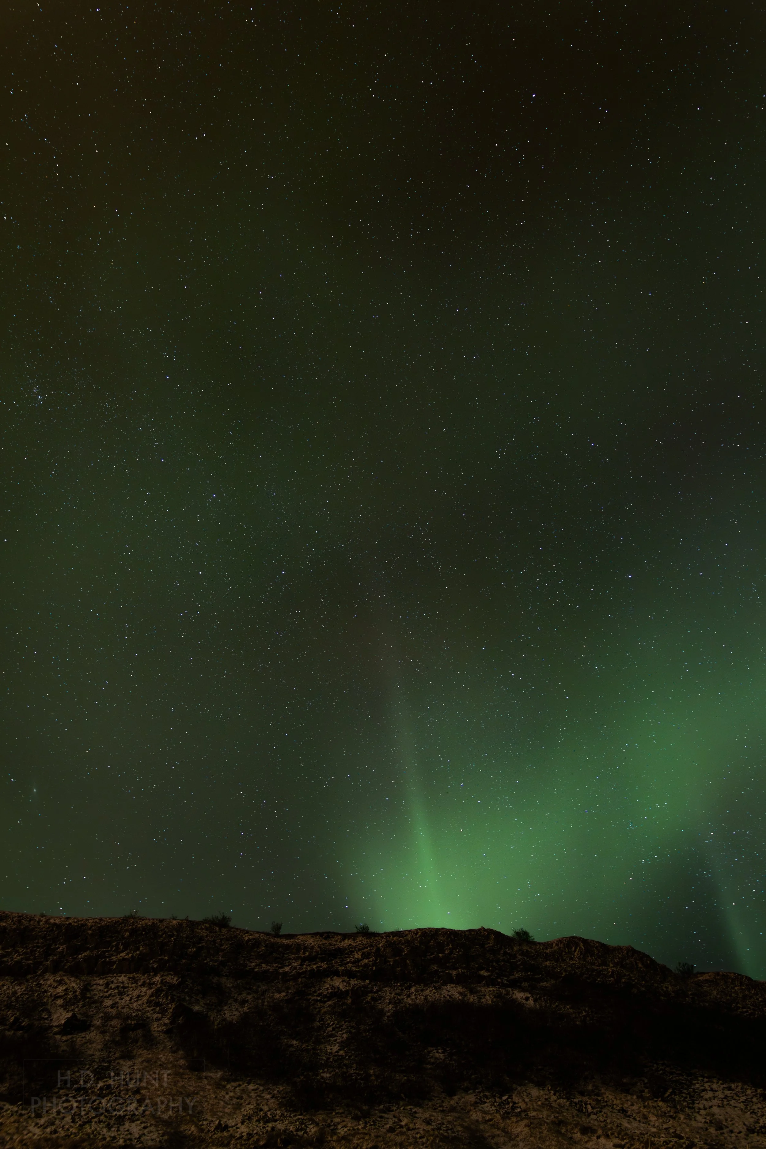 The green light of Aurora Borealis - the Northern Lights - is seen north of Reykholt í Biskupstungum, Iceland.