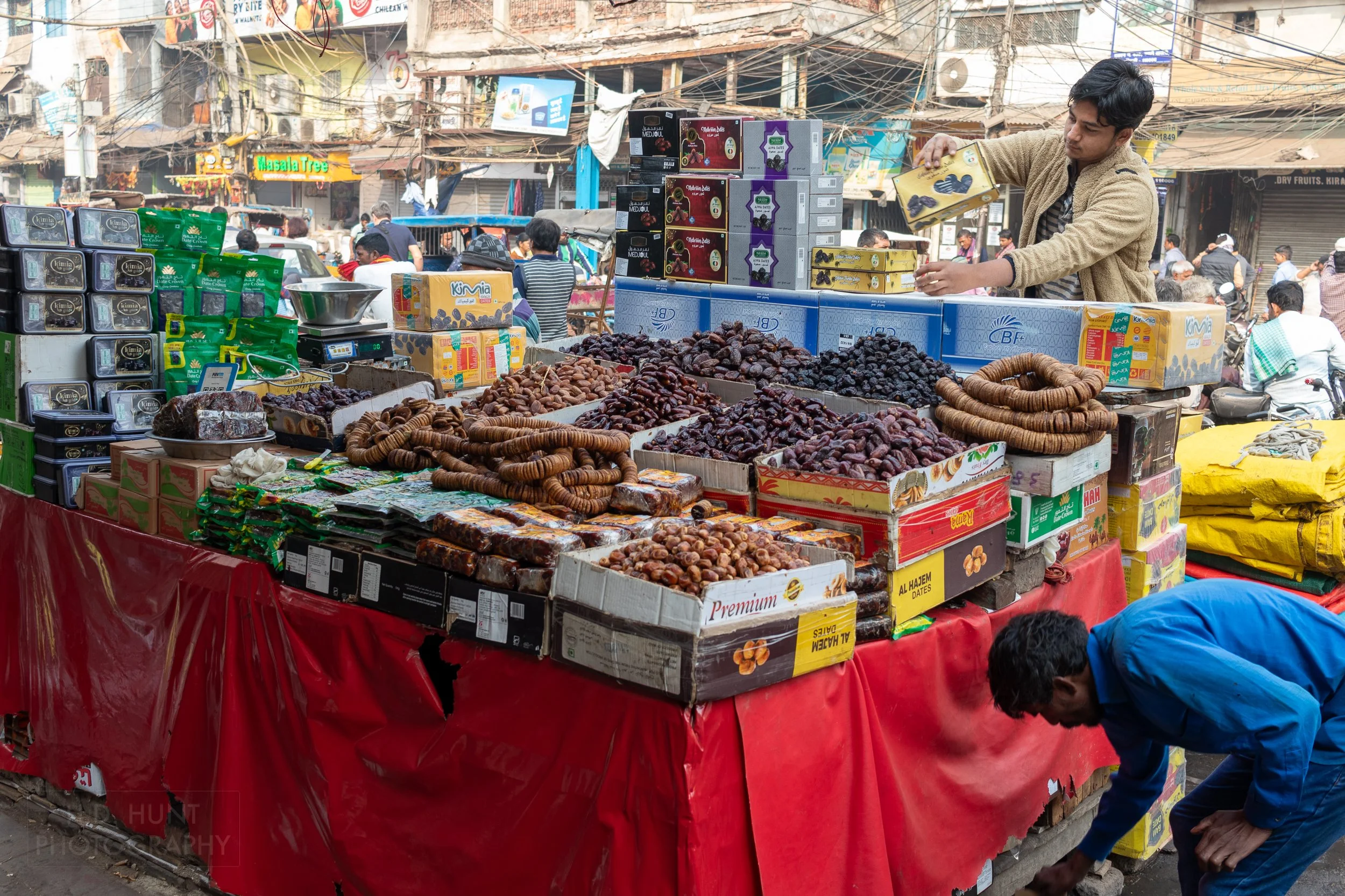 Dried fruit and spices for sale at a market table, Chandni Chowk, Delhi, India.
