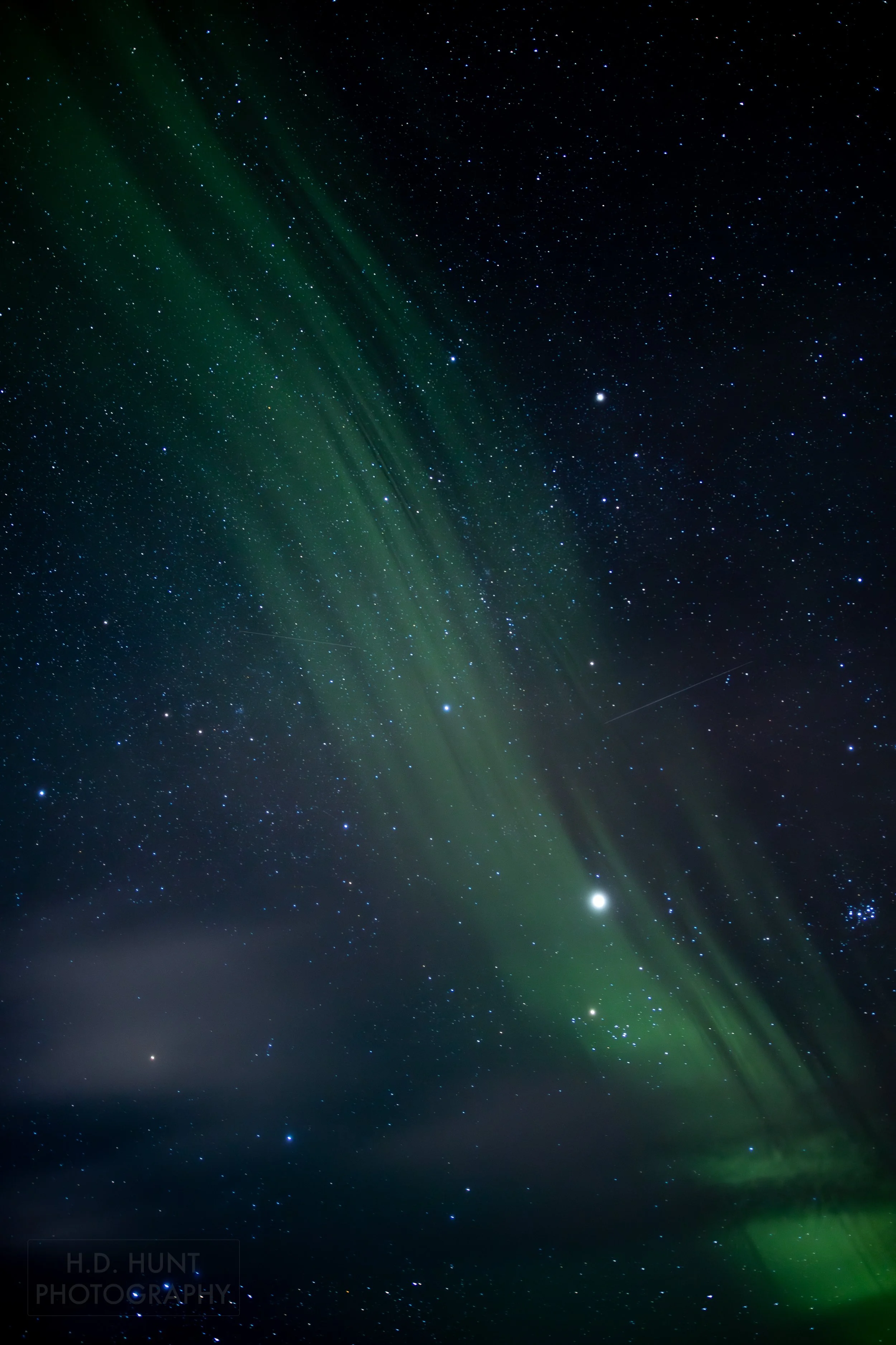 The green light of Aurora Borealis - the Northern Lights - is seen north of Grindavik on the Reykjanes Peninsula, Iceland.
