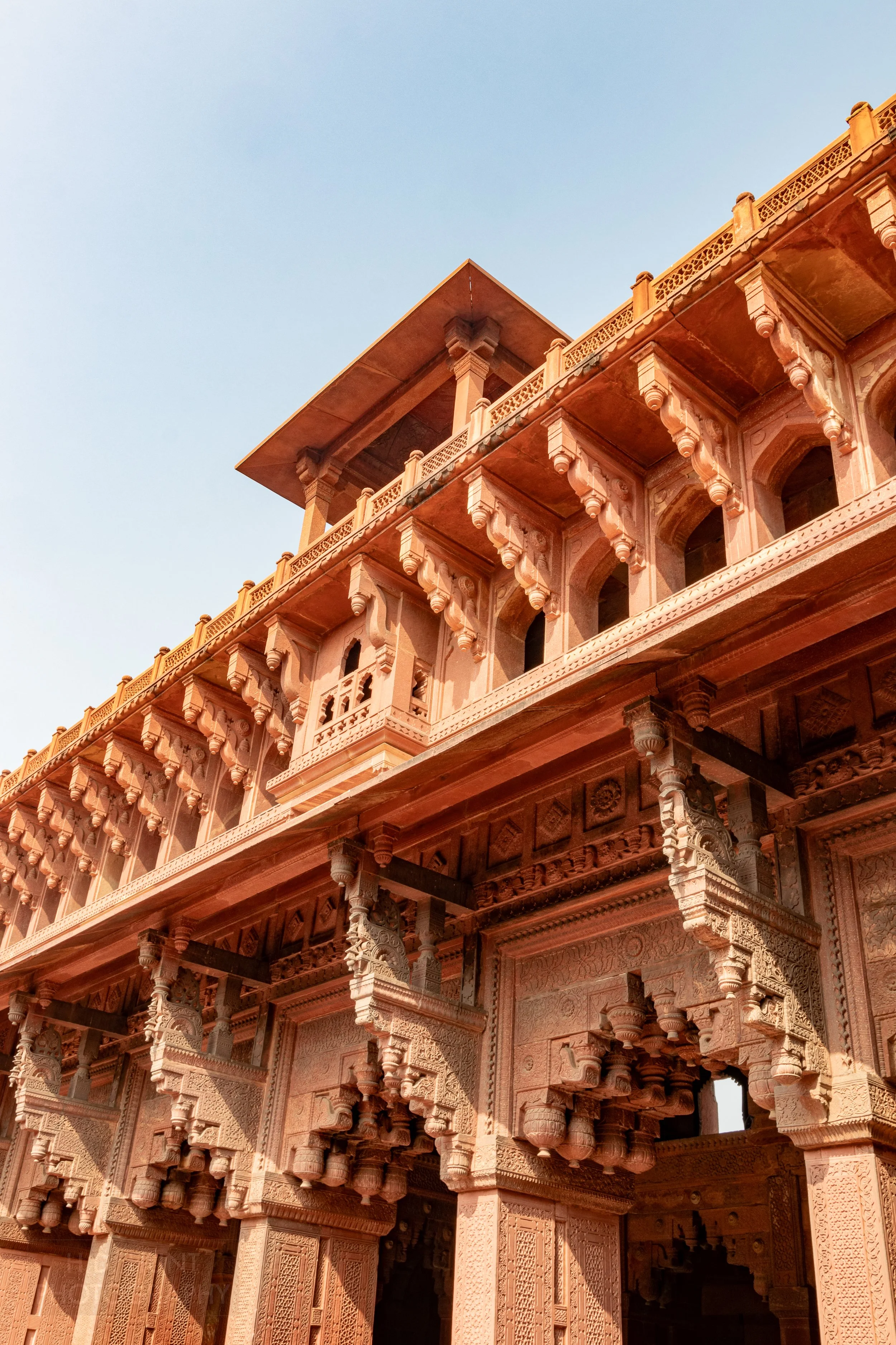 A large intricately designed and carved balcony is seen within Agra Fort, Agra, India.