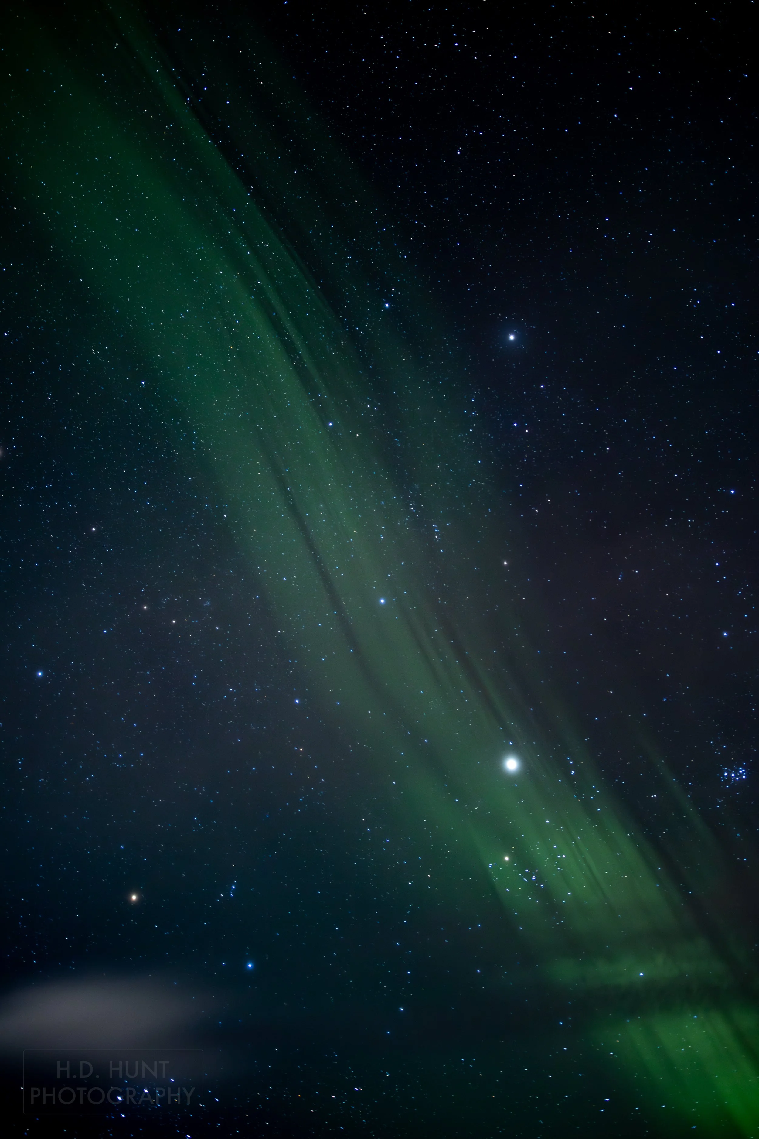 The green light of Aurora Borealis - the Northern Lights - is seen north of Grindavik on the Reykjanes Peninsula, Iceland.