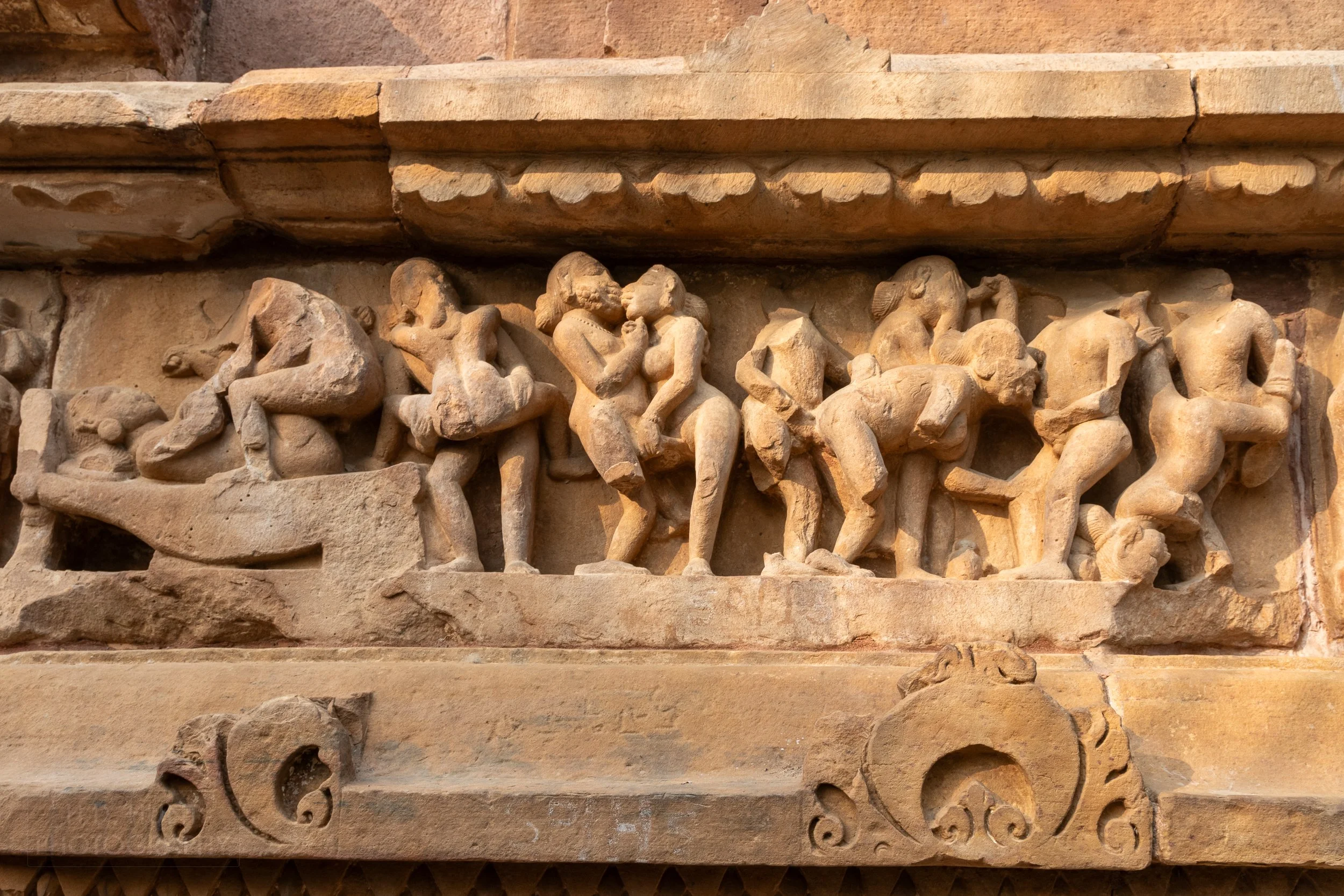 Close-up of the stone carvings adoring the Lakshmana Temple, Khajuraho Group of Monuments, India.