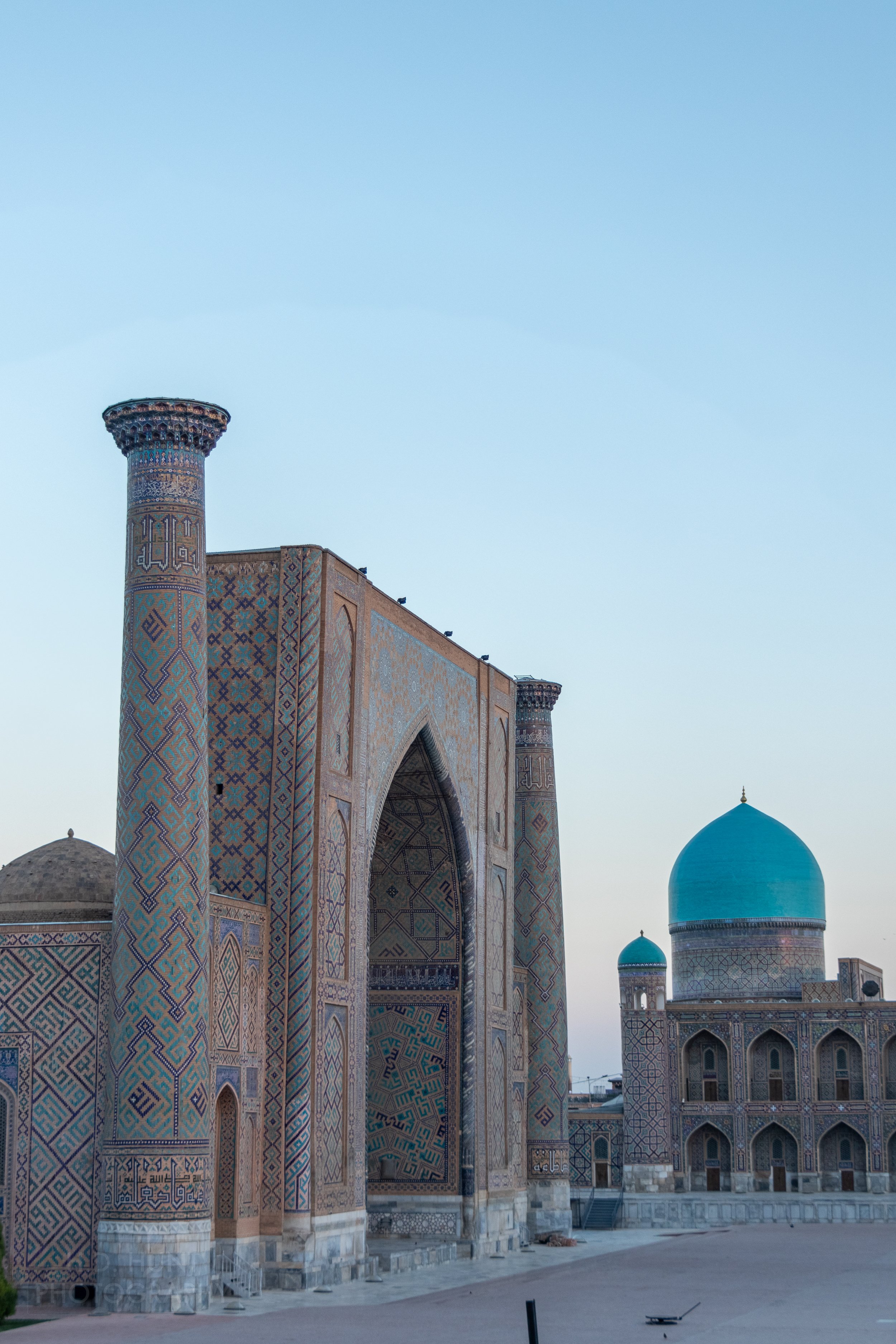 The Ulugh Beg Madrasa illuminated at sunrise, Registan, Samarkand, Uzbekistan.