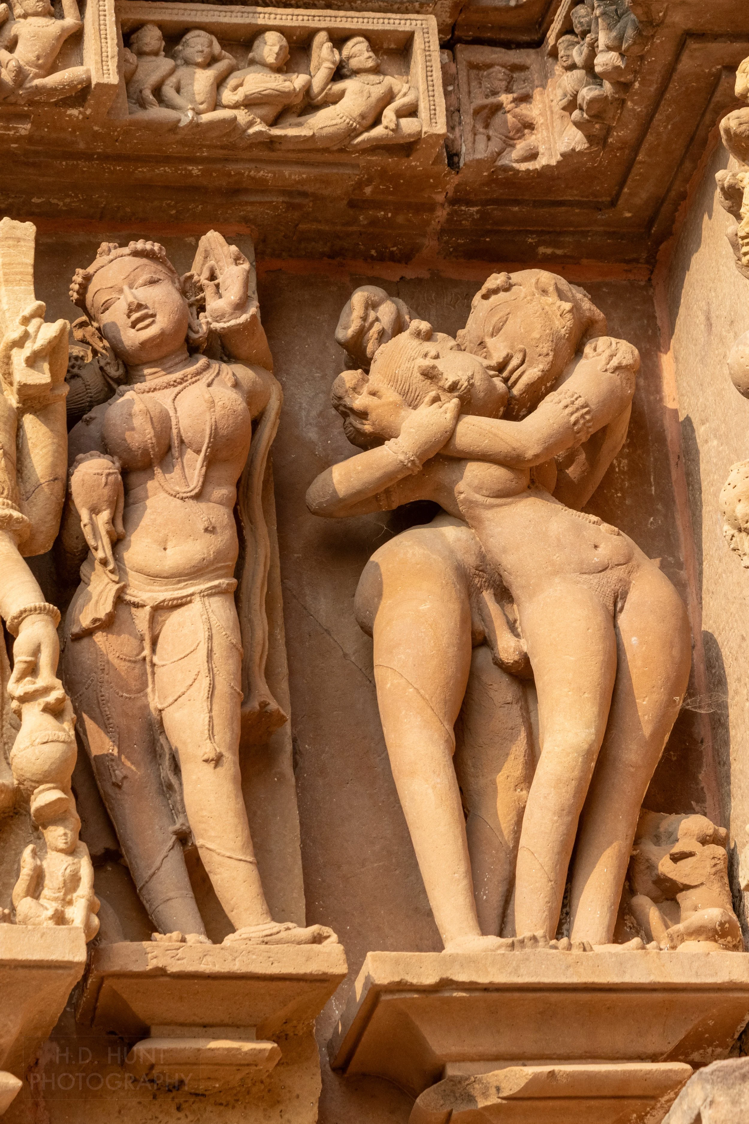 Close-up of the stone carvings adoring the Lakshmana Temple, Khajuraho Group of Monuments, India.