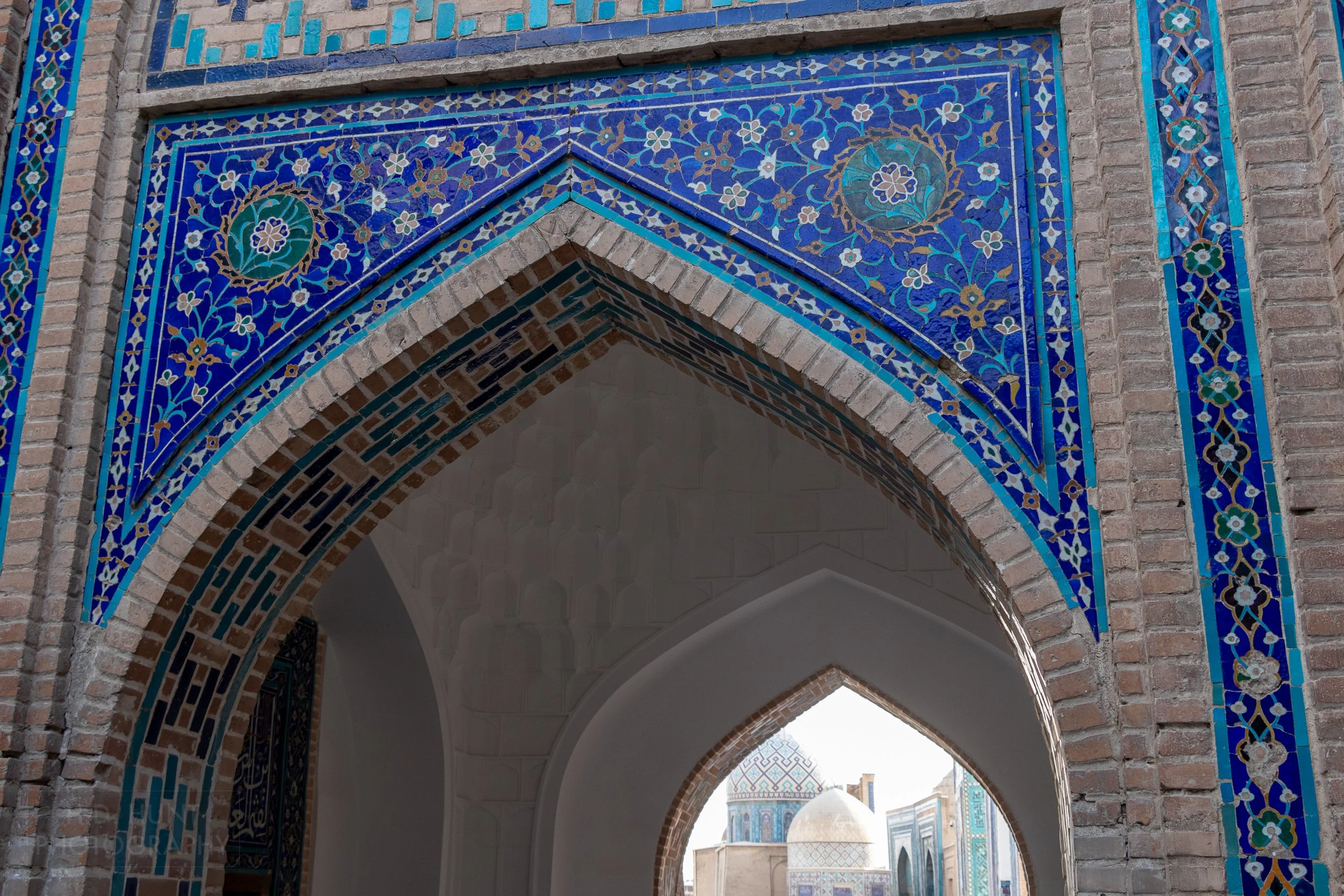 Blue tile archway at the Shah-i-Zinda necropolis in Samarkand, Uzbekistan.