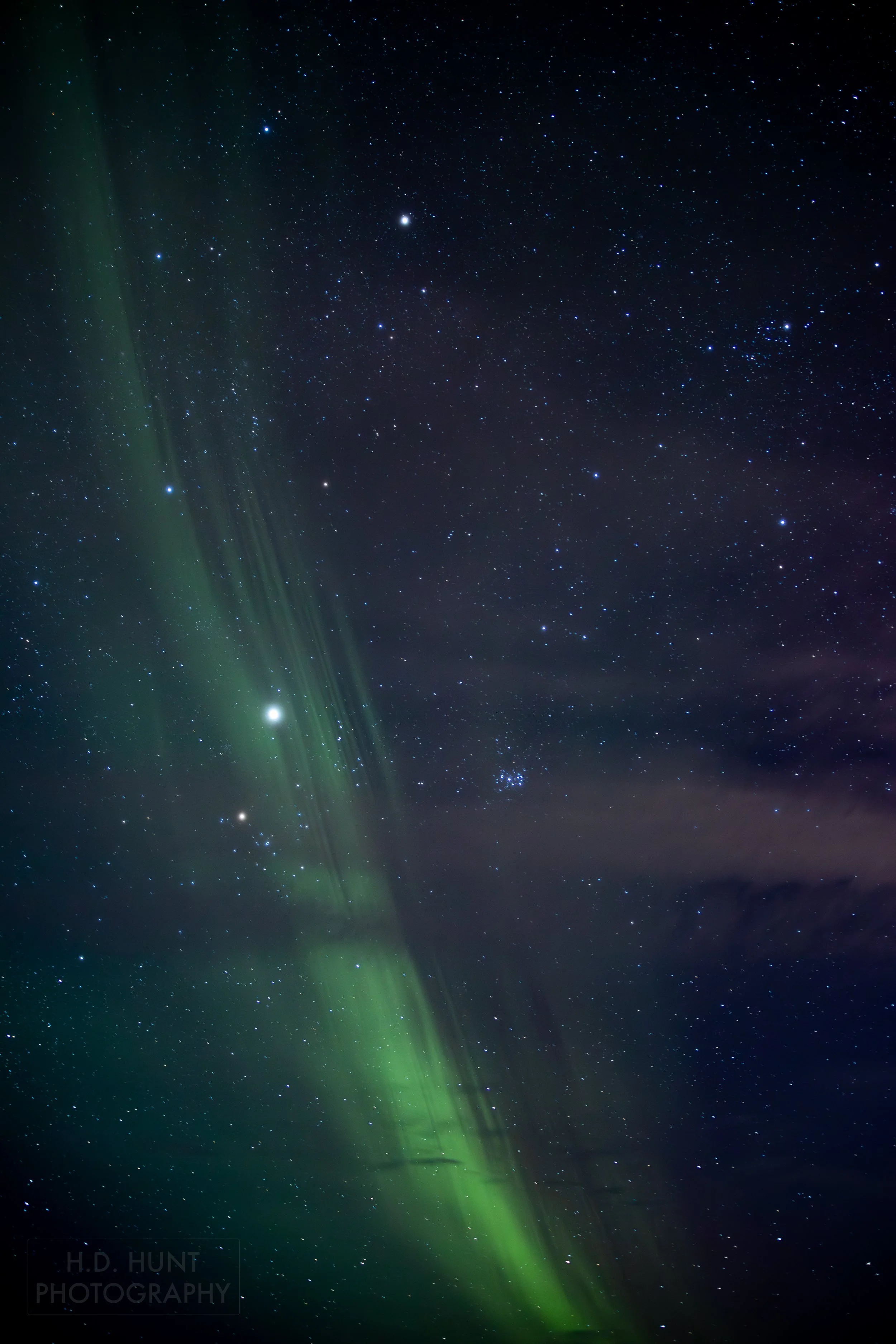 The green light of Aurora Borealis - the Northern Lights - is seen north of Grindavik on the Reykjanes Peninsula, Iceland.