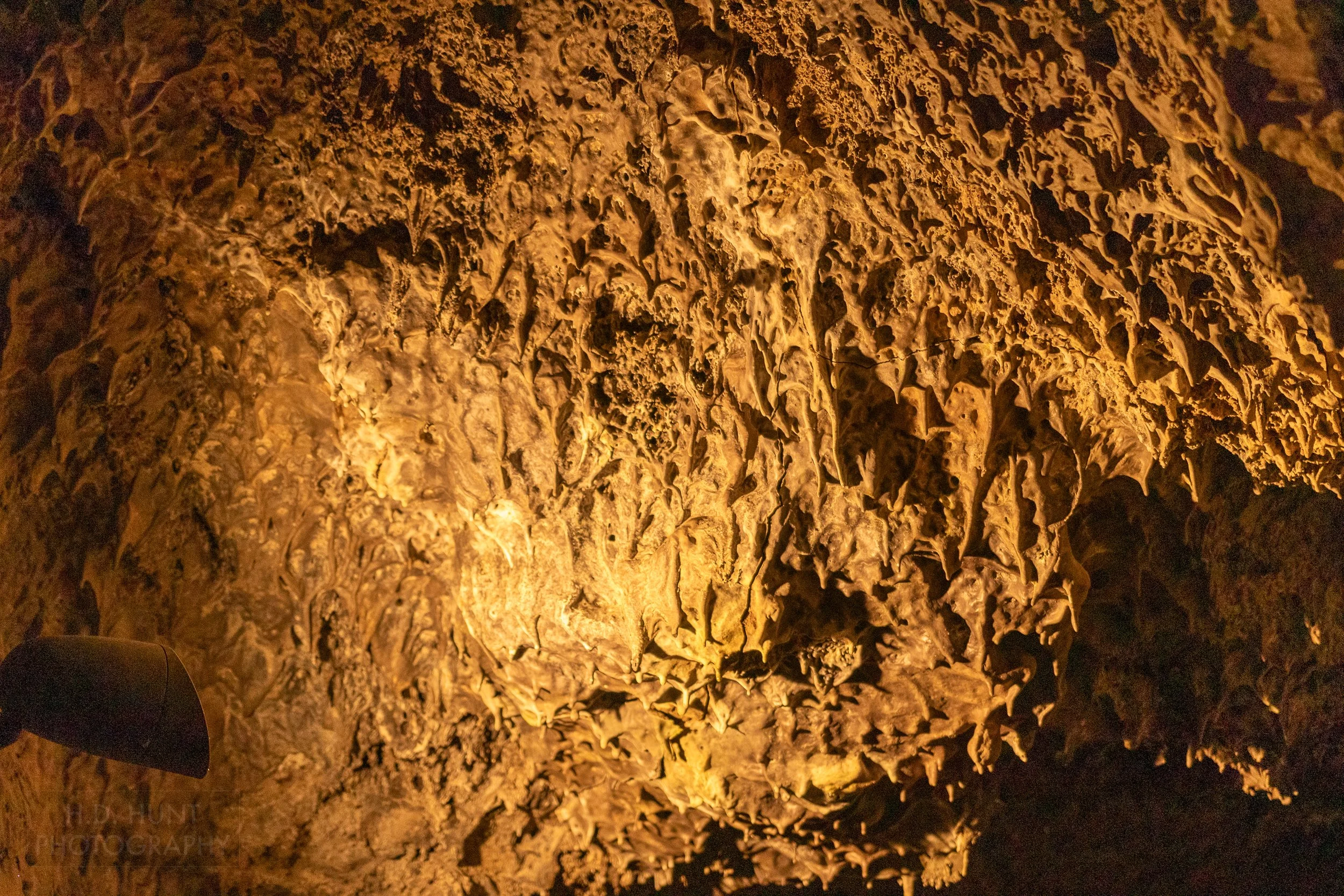Long thin rock hands from a lava tube ceiling, Lava Beds National Monument, California, United States.