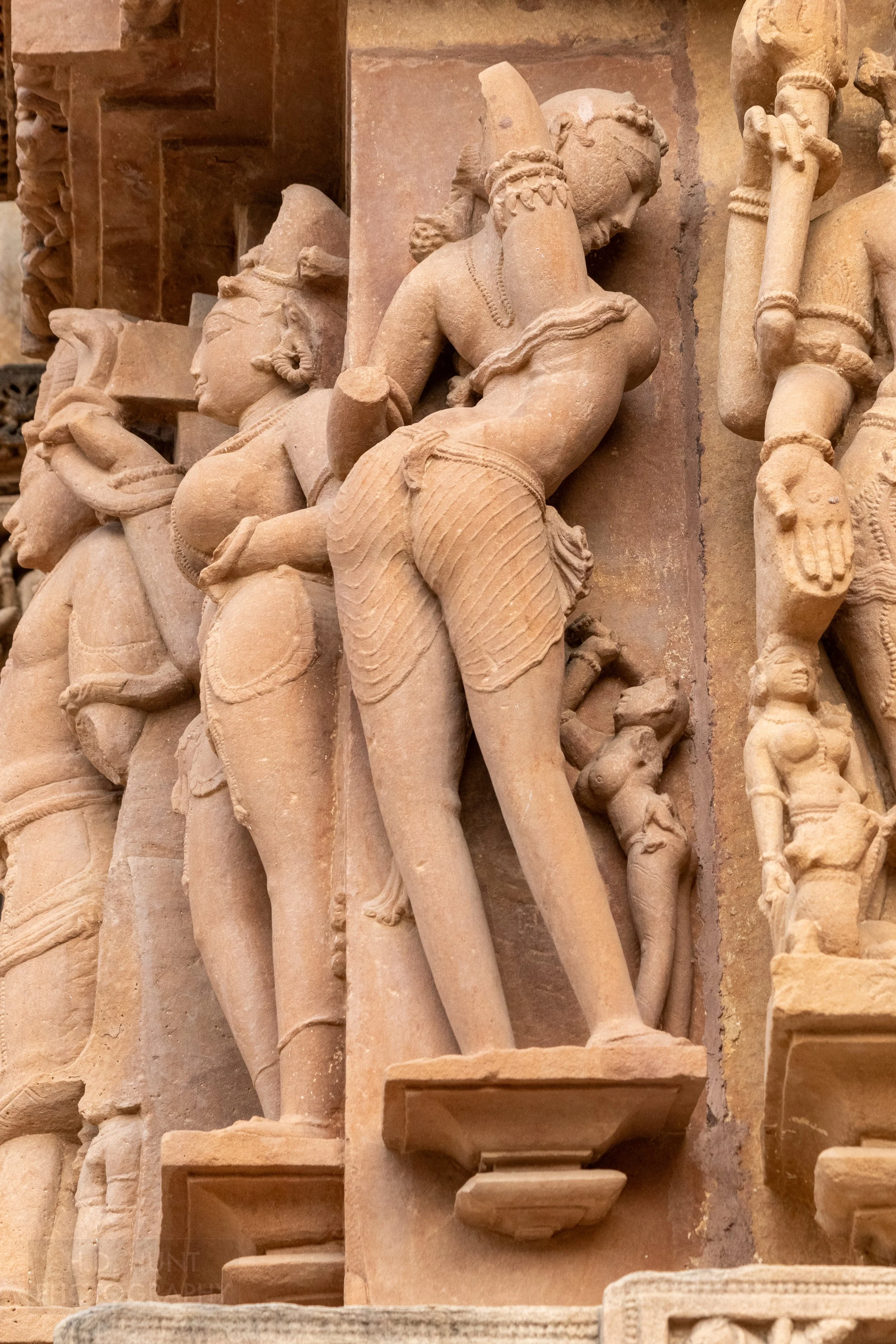 Close-up of the stone carvings adoring the Lakshmana Temple, Khajuraho Group of Monuments, India.
