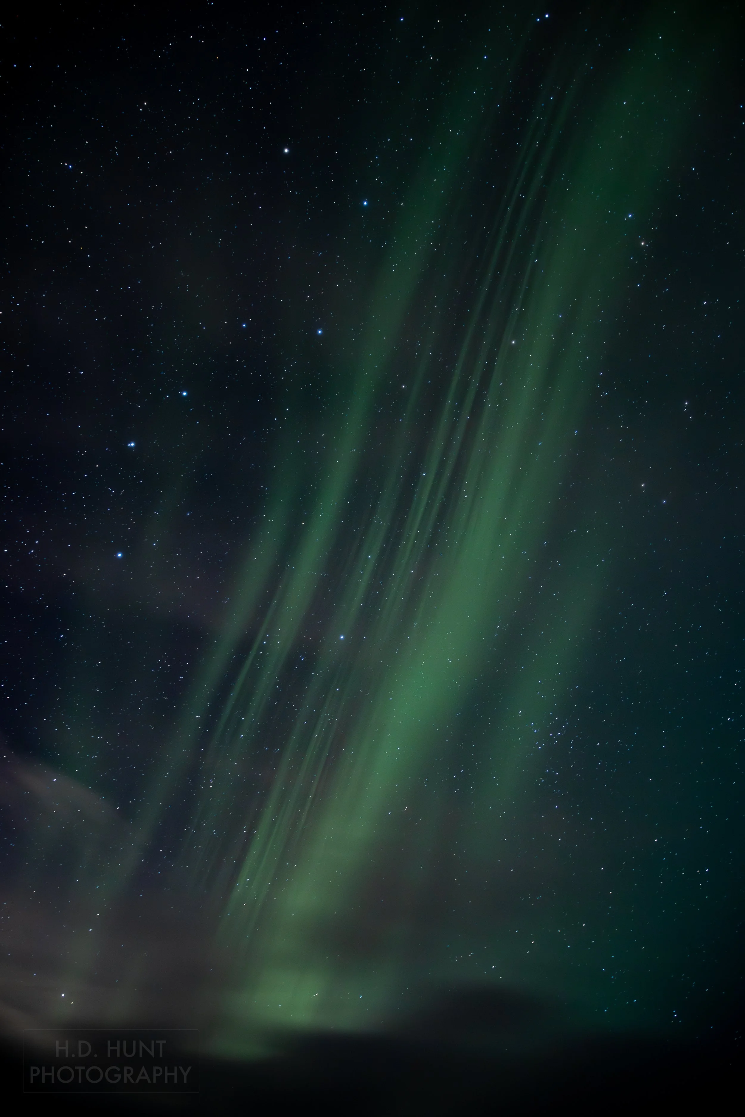 The green light of Aurora Borealis - the Northern Lights - is seen north of Grindavik on the Reykjanes Peninsula, Iceland.