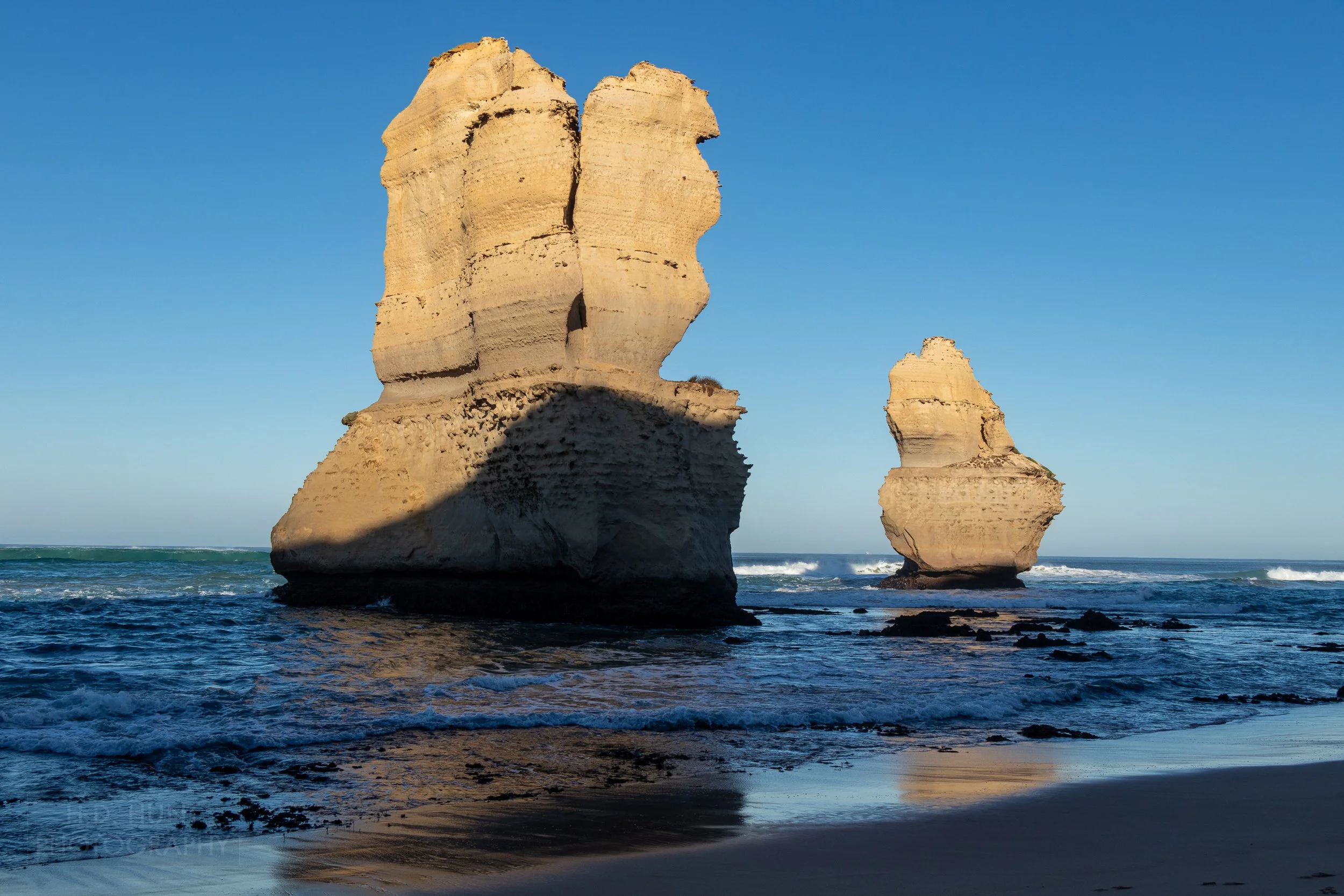 Two rock spires emerge from the Southern Ocean along Gibson Beach Victoria, Australia.