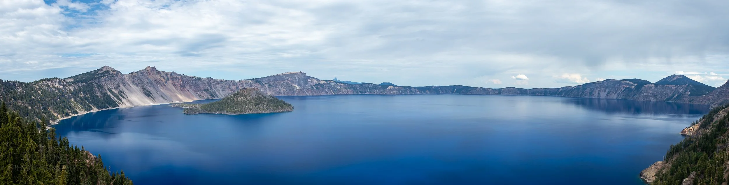 A view of the blue waters of Crater Lake from the Sinnott Memorial, Crater Lake National Park, Oregon, United States.