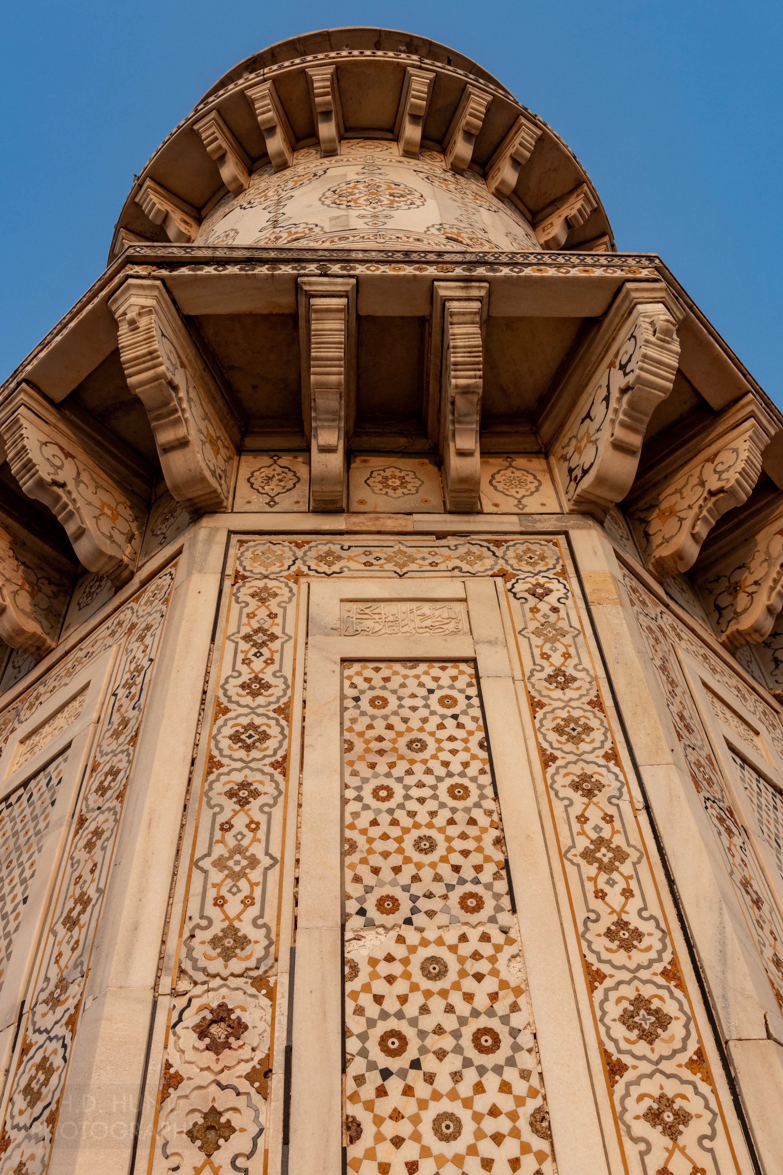 Detailed multi-colored tiles are seen on the exterior wall of the Tomb of I’timad-ud-Daulah, Agra, India.