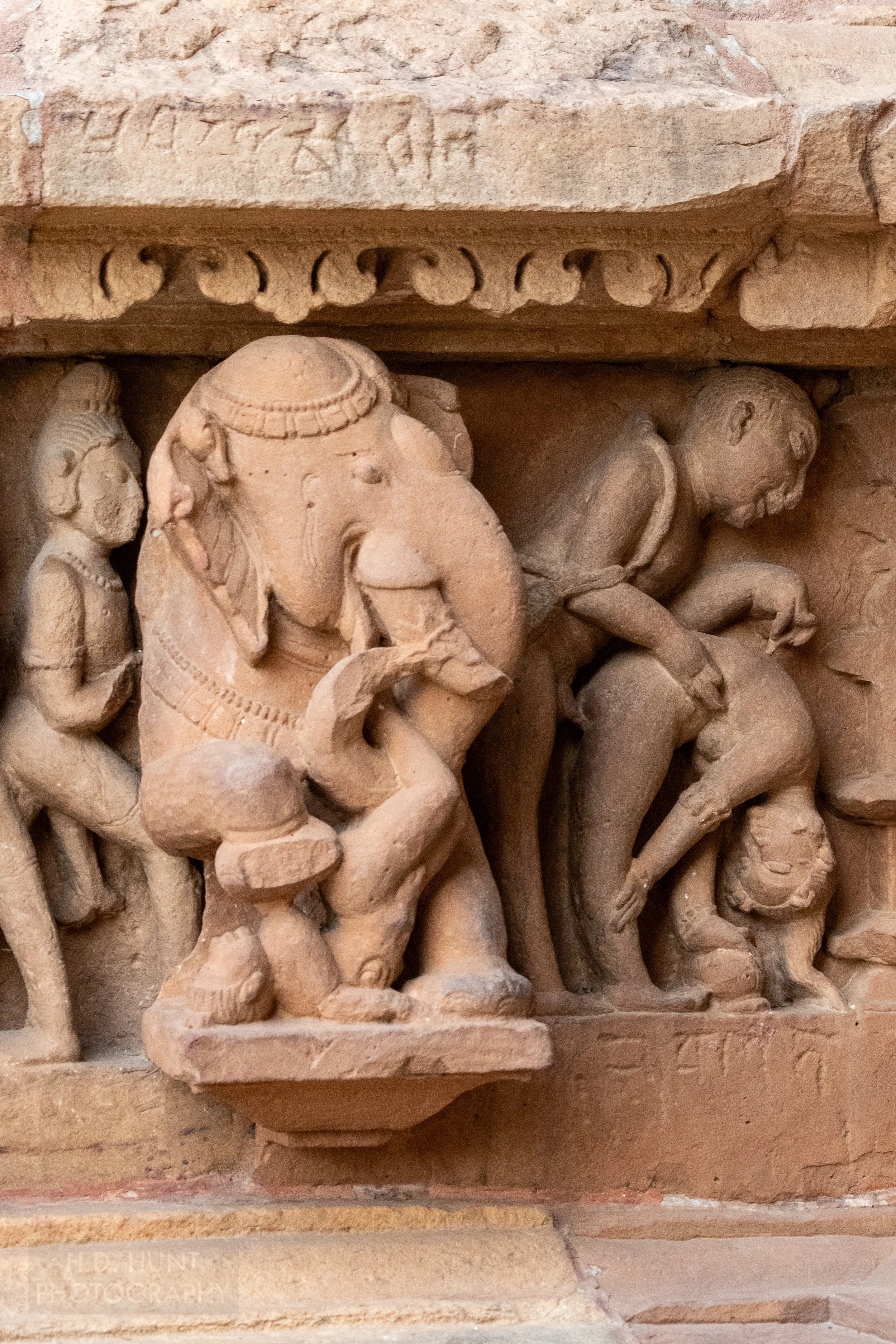 Close-up of the stone carvings adoring the Lakshmana Temple, Khajuraho Group of Monuments, India.
