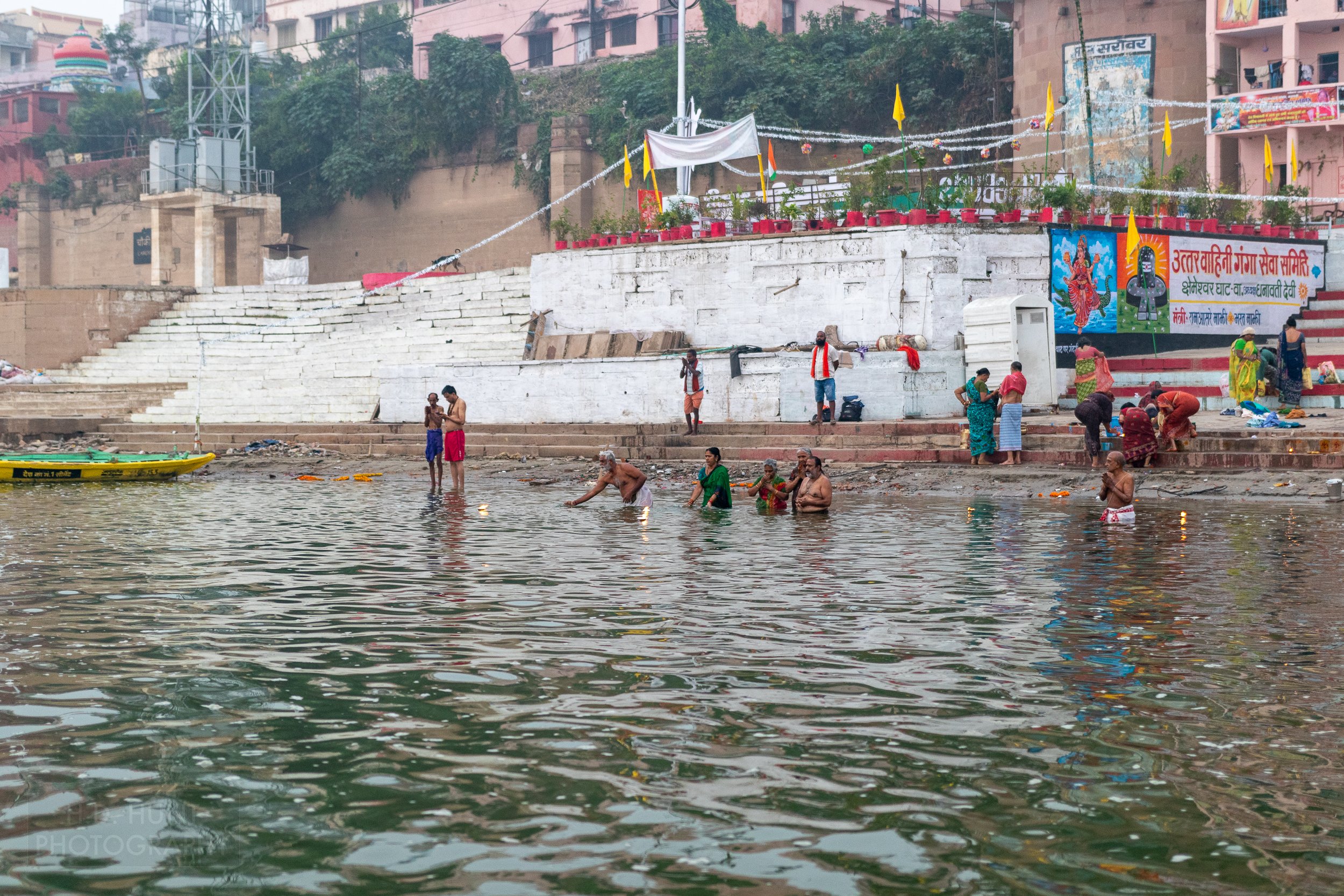 Multiple worshipers bathe in the Ganges River, Varanasi, India.