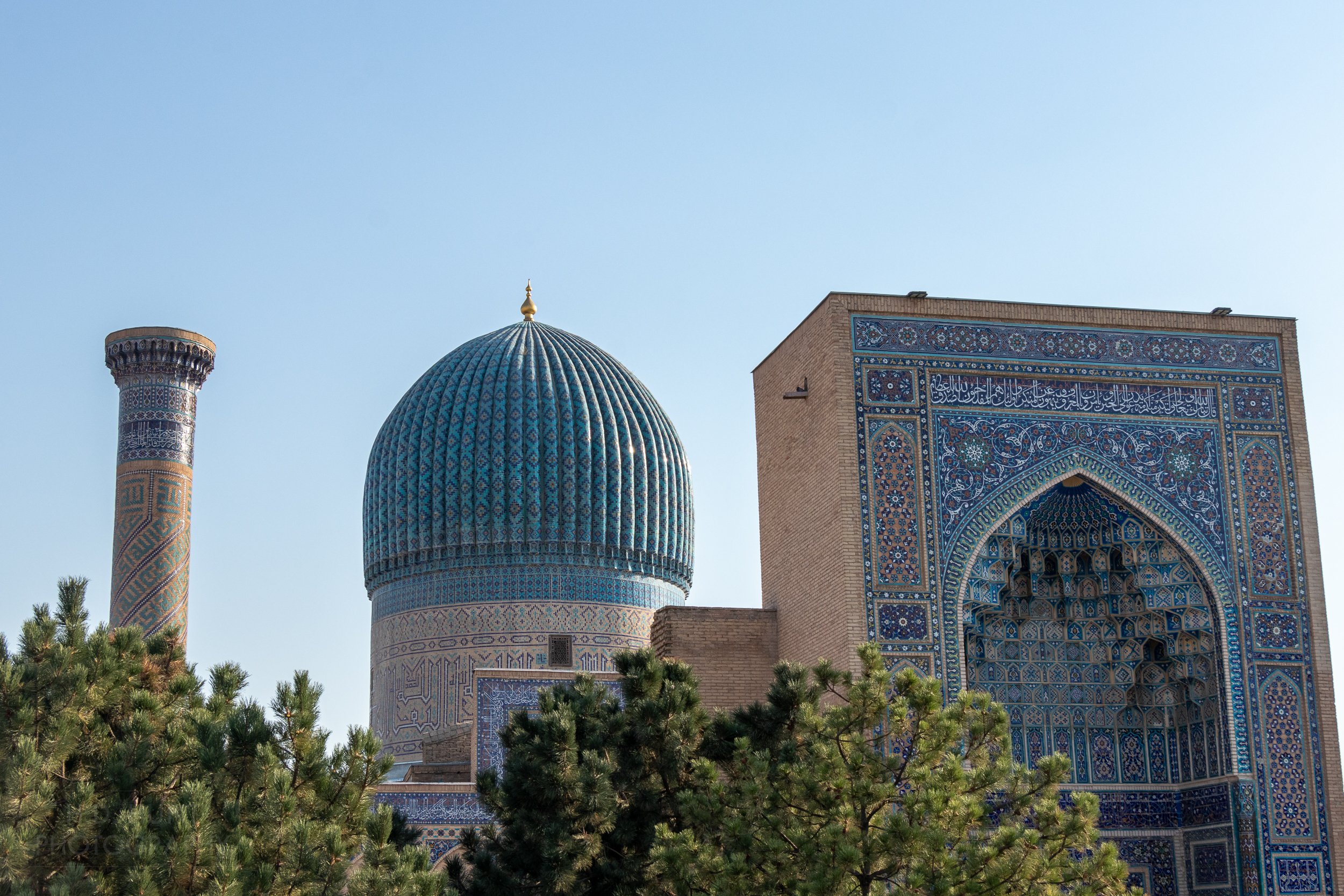 Central dome, main entrance archway, and minaret of the Amir Temur Mausoleum in Samarkand, Uzbekistan.