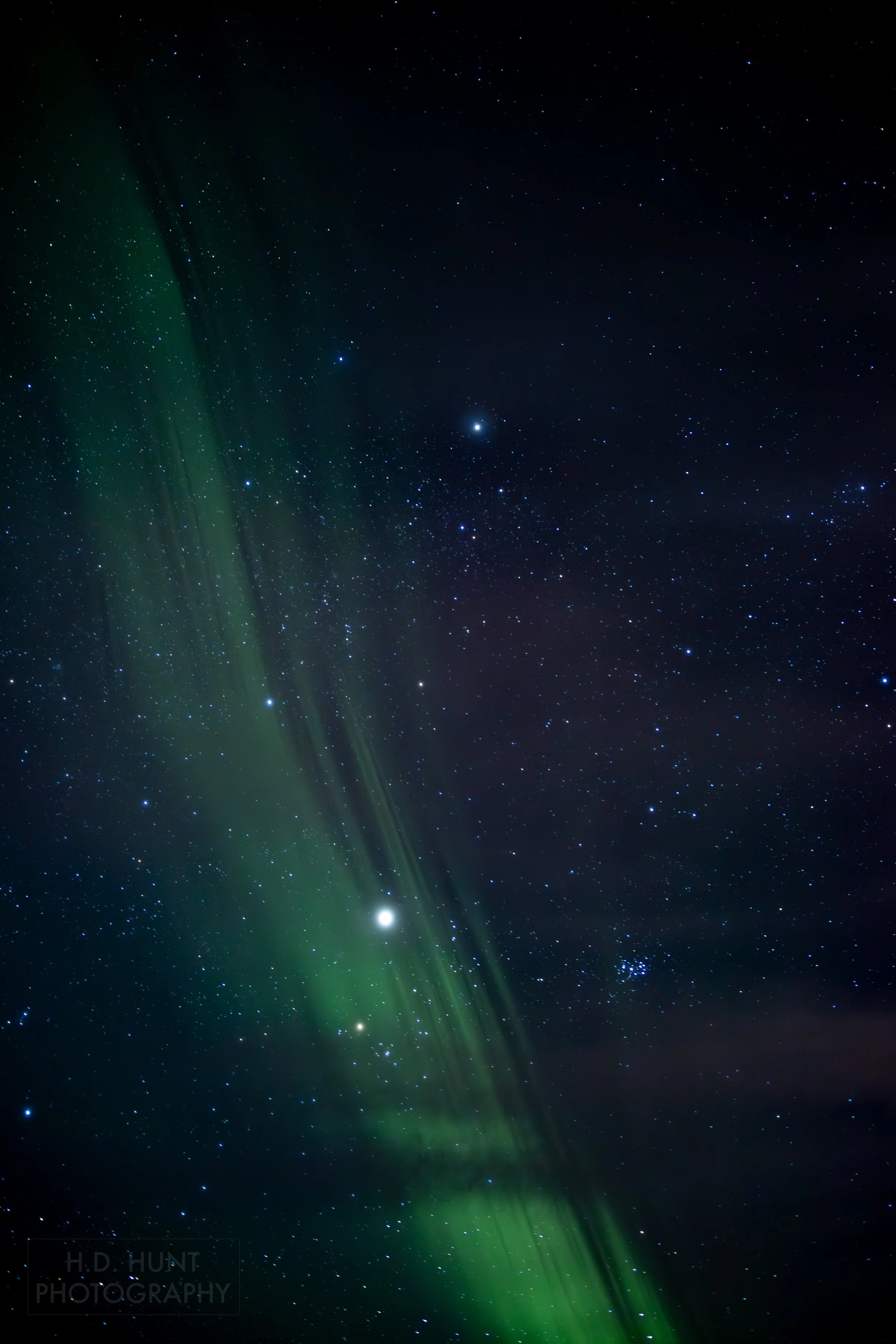 The green light of Aurora Borealis - the Northern Lights - is seen north of Grindavik on the Reykjanes Peninsula, Iceland.