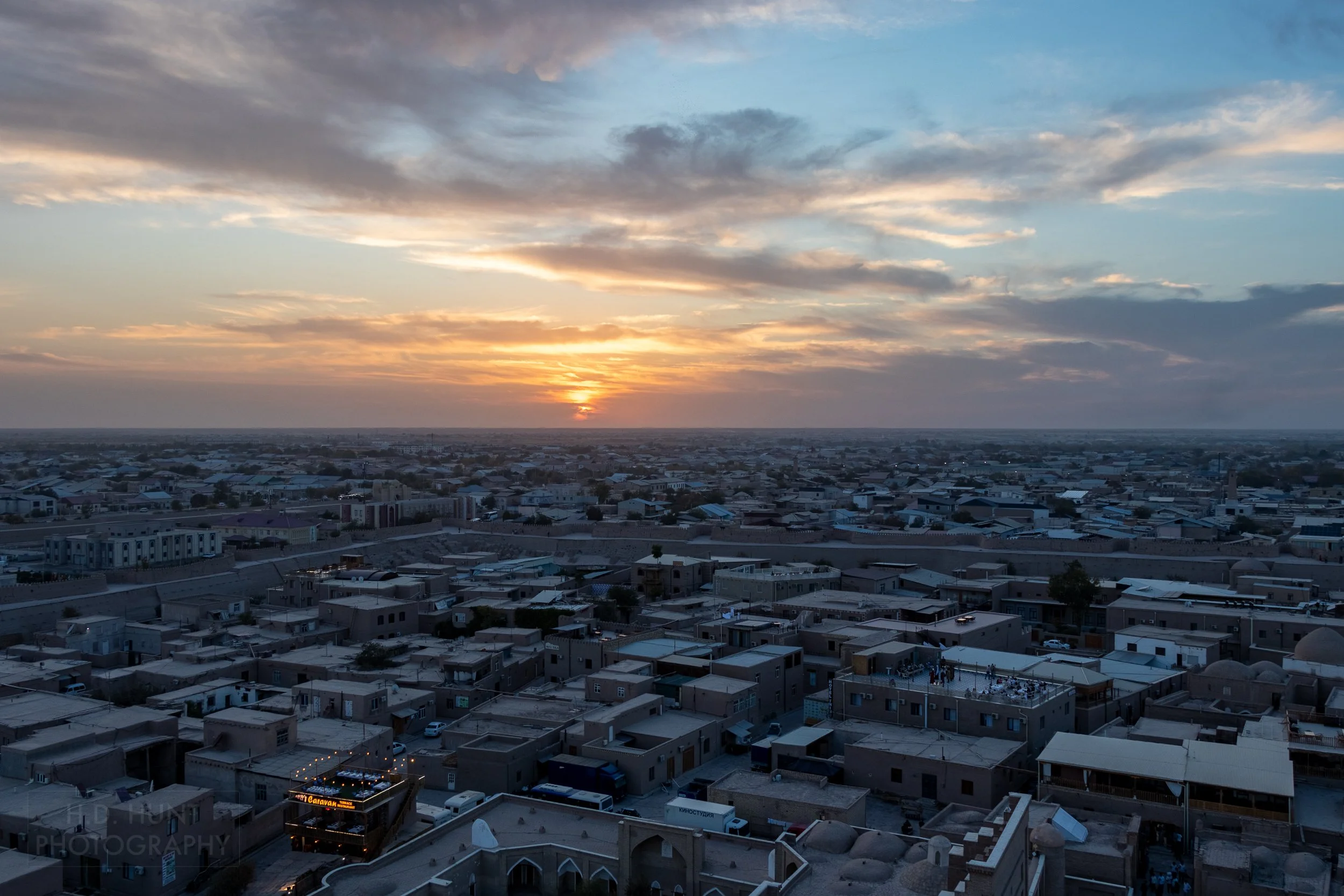 The sunset is seen from the top of the Islam Khoja Minaret, Khiva, Uzbekistan.