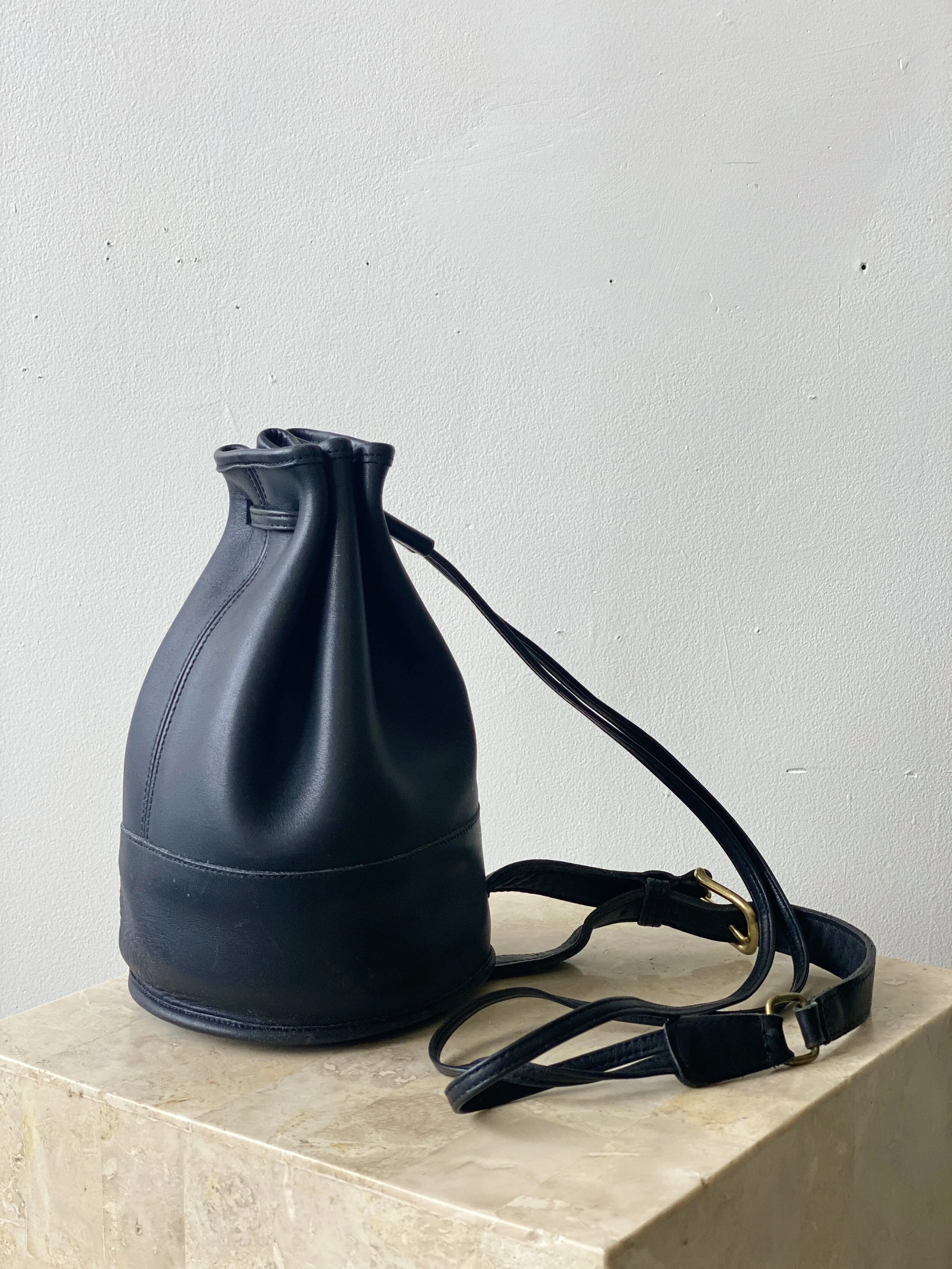 coach black leather drawstring bucket sling backpack Vintage Coach Small Bixby Sling Bag — portmanteau new york
