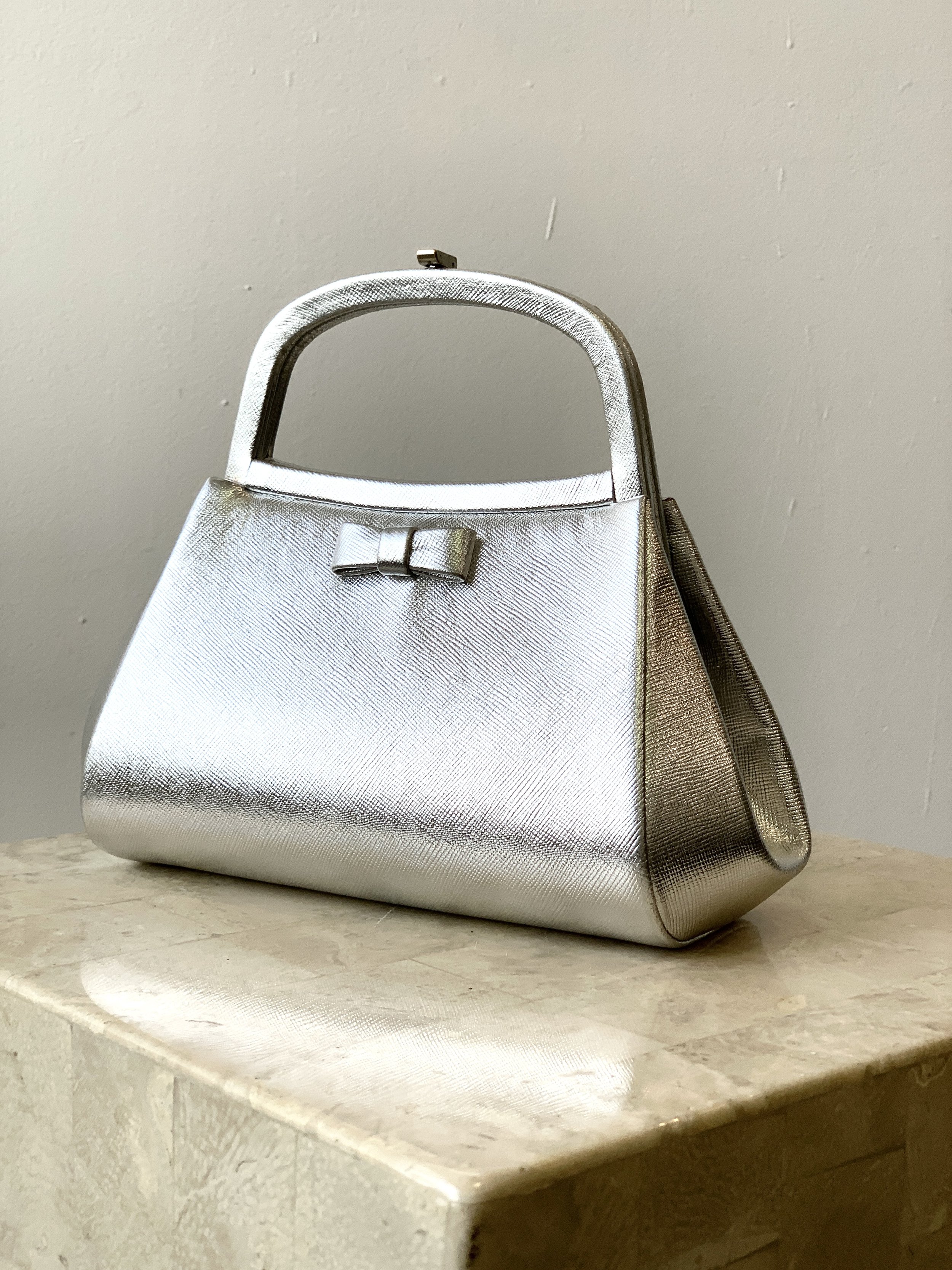 Vintage Silver Saffiano Leather Handbag with Bow Detail by Bienen-Davis,  Circa 1950s-60s — portmanteau new york