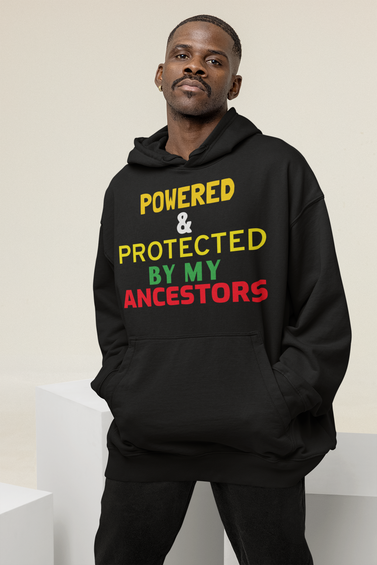 oversized-hoodie-mockup-of-a-man-posing-at-a-studio-behind-some-cubes-m26163.png