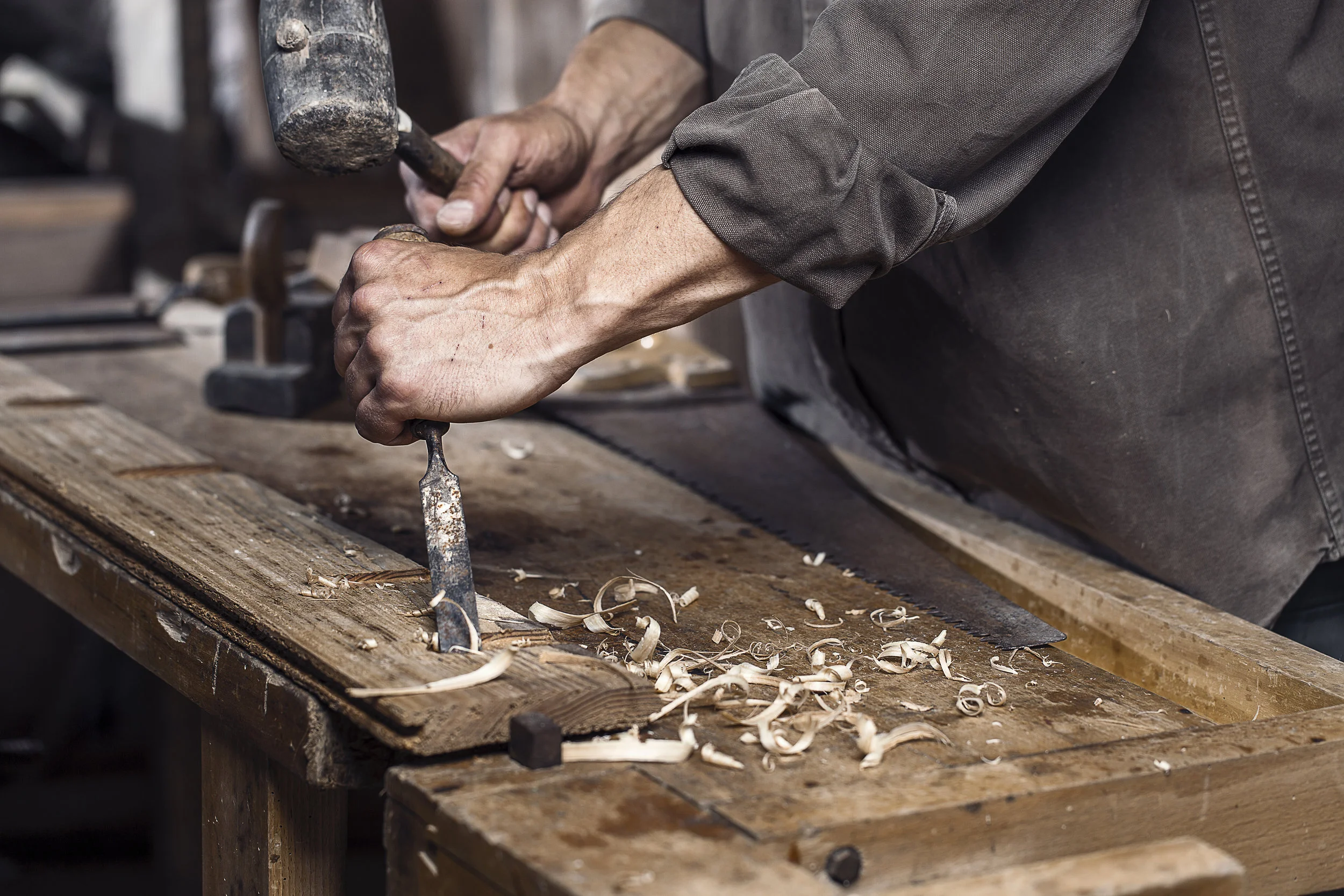 bigstock-Carpenter-With-A-Hammer-And-Ch-97115342.jpg