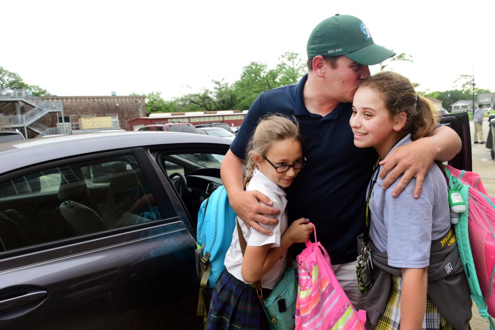 CHERYL GERBER University of New Orleans senior Timothy Juhas, 31, drops off his daughters at a rehearsal for a play in New Orleans during a late-afternoon lunch break from his job in Jefferson Parish, La.