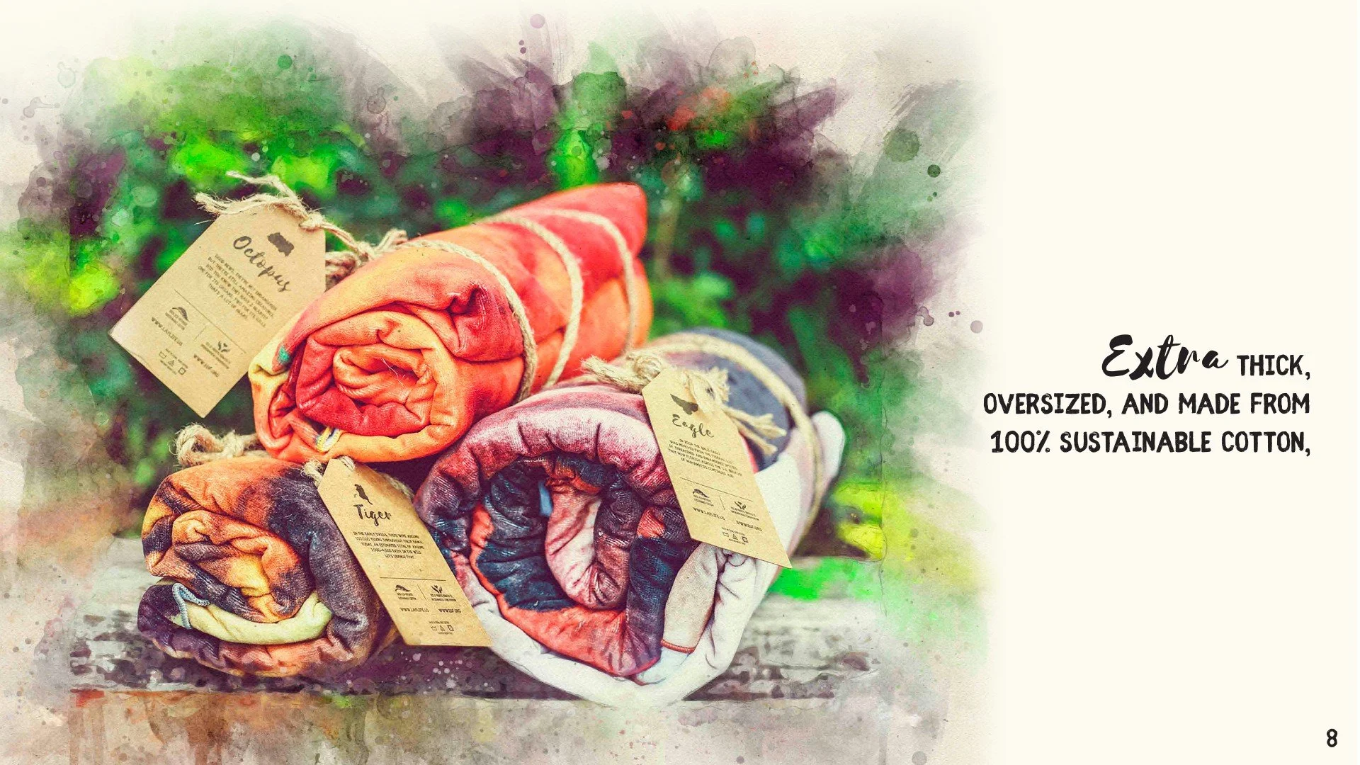 Stacked colorful, thick, oversized fabric blankets or towels on a surface with tags attached, and a background of watercolor-style green and purple hues. Text on the right side reads, "Extra thick, oversized, and made from 100% sustainable cotton."