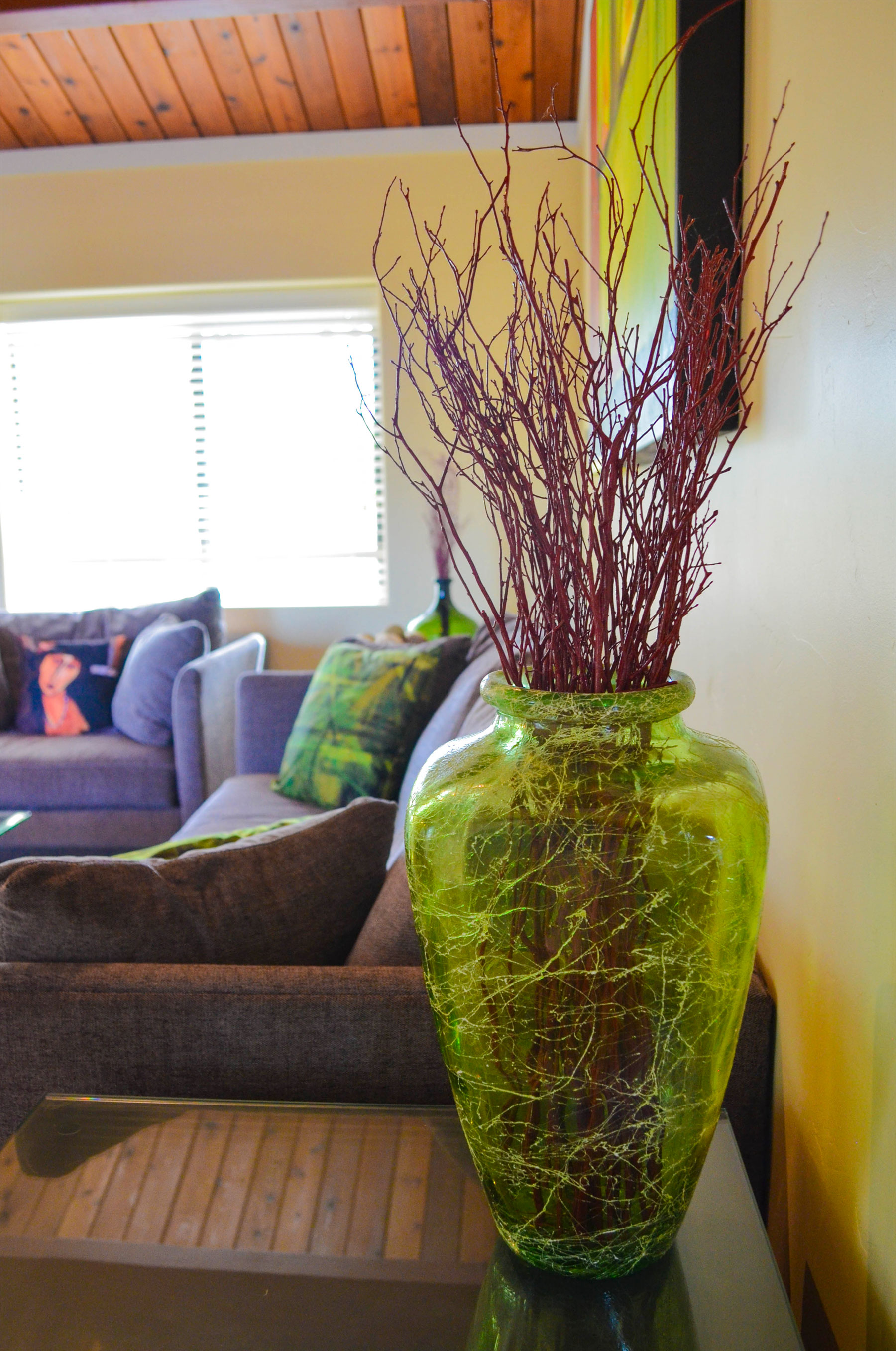 a vase of dried branches decorate the Common Area Hilltop Glen East at Indian Creek Inn, Anderson Valley lodging in Philo, CA