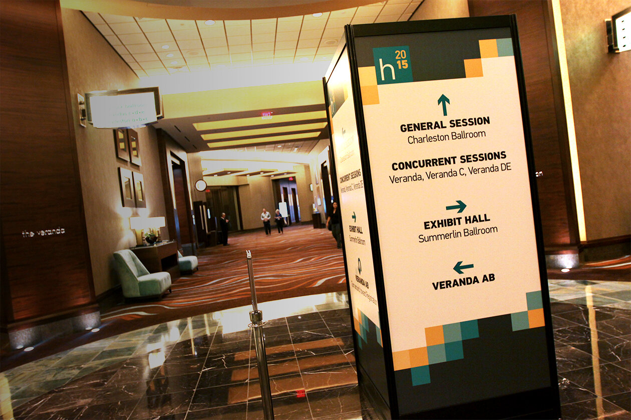   CENTRAL SQUARE:  This wayfinding sign was the center of the conference and directed attendees to sessions down 4 hallways 