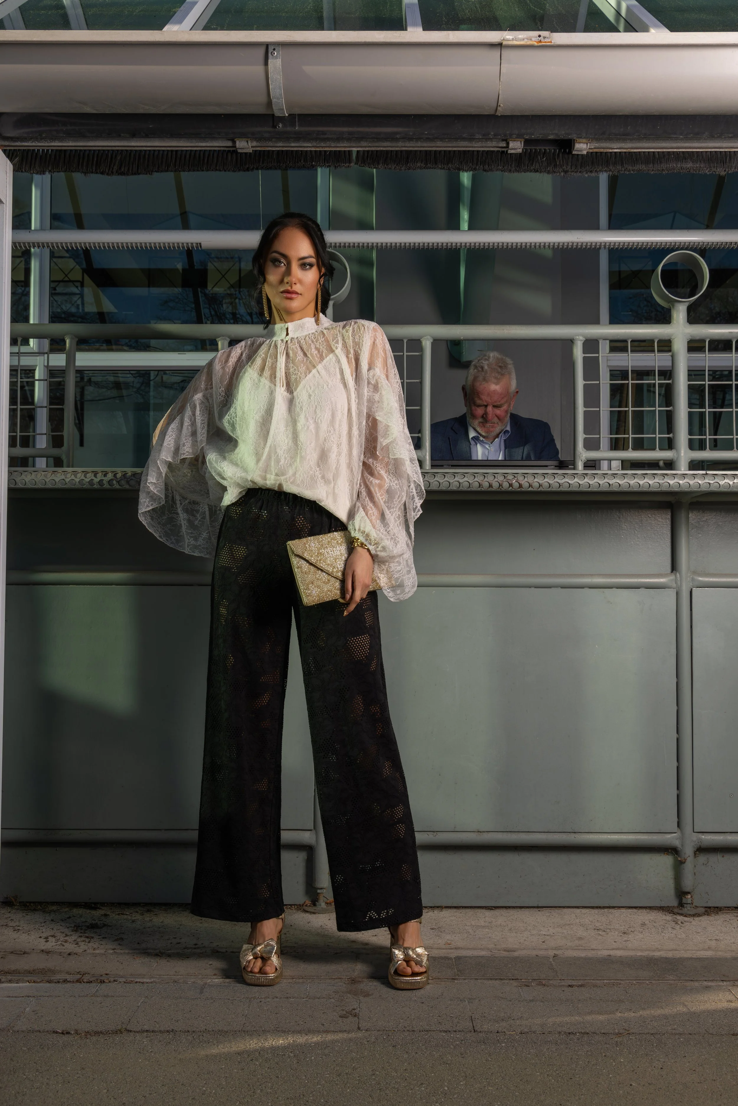  Sheer dressing is having a real moment; lace, transparency, and texture can add interest to an outfit while still feeling sophisticated. The contrast here between the romantic blouse and the stronger black trouser is a mix of masculine and feminine 