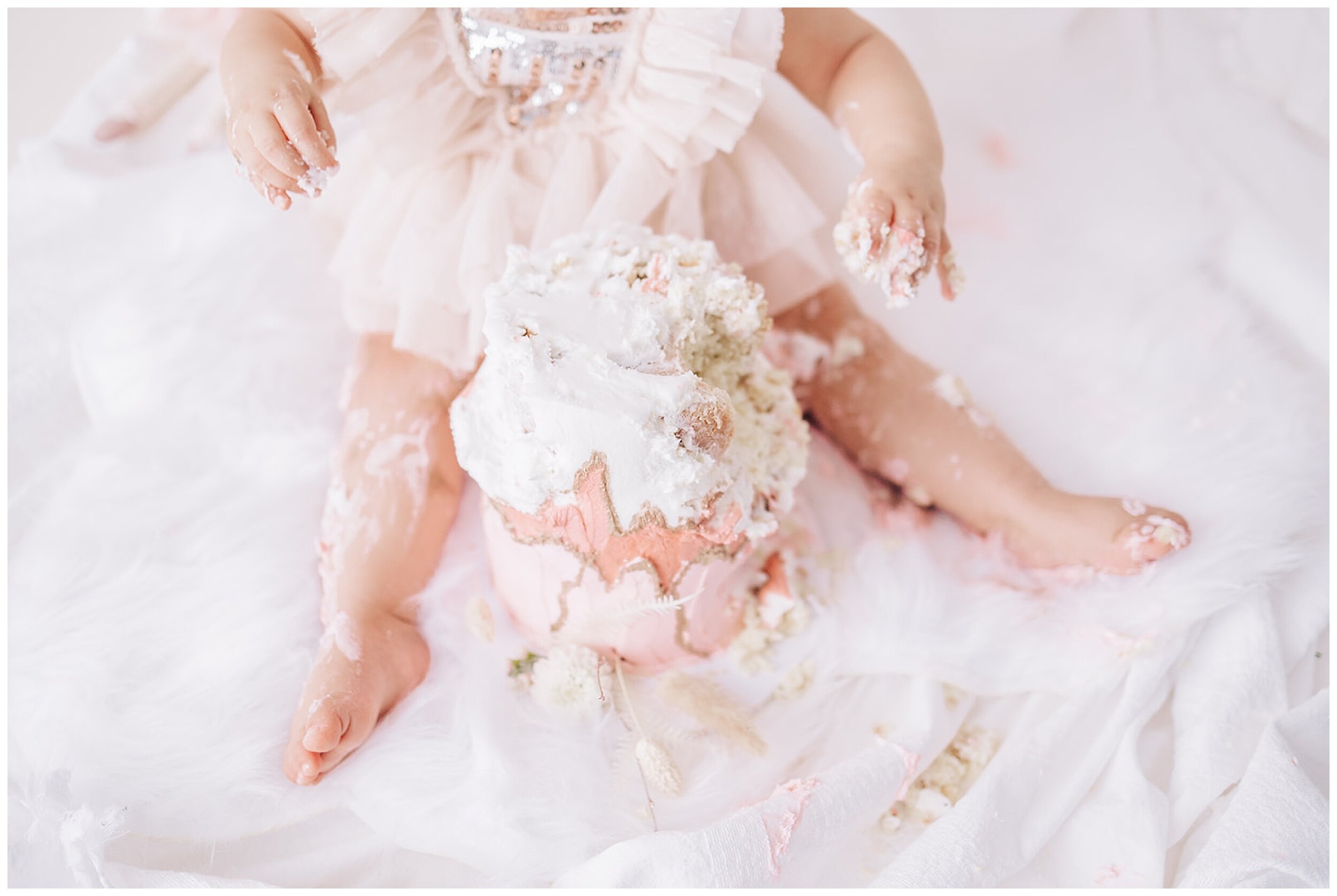 girl eating cake with hands for cake smash