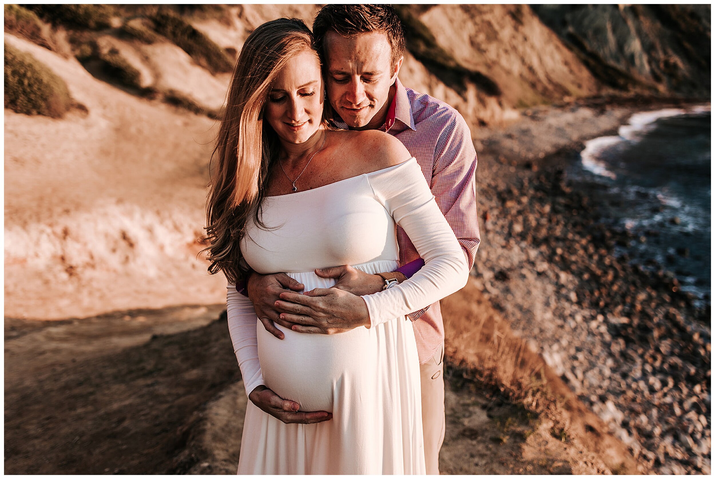 husband hugging wife's pregnant belly