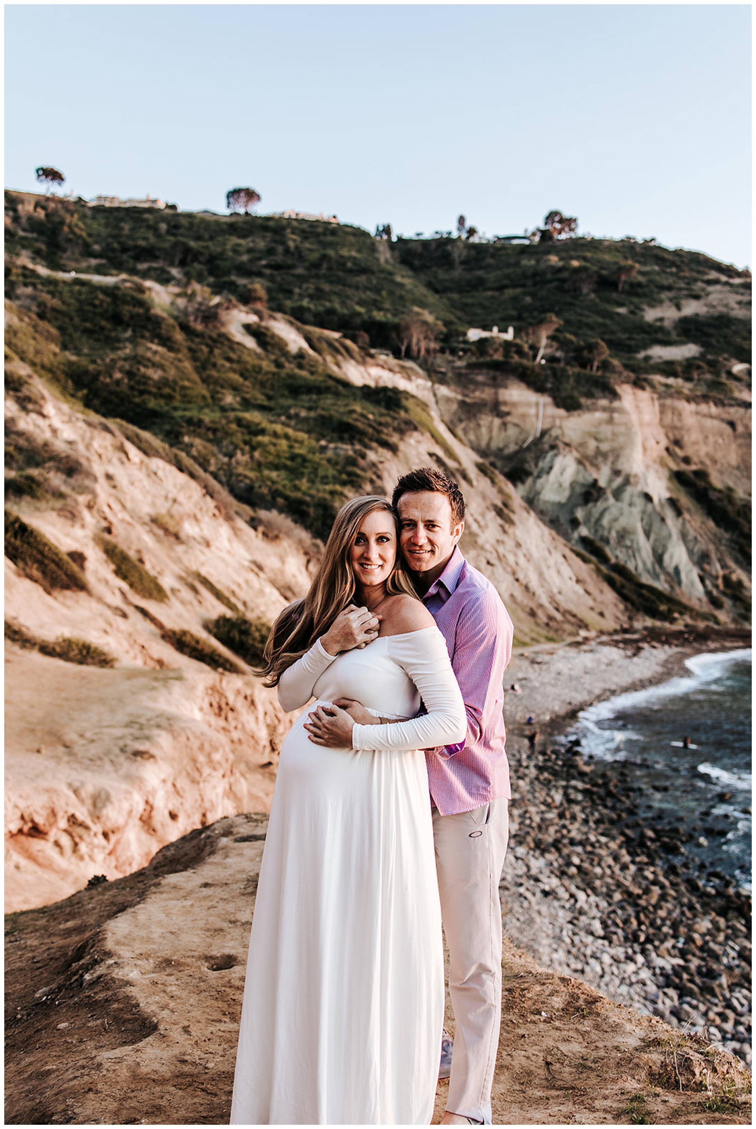 husband and pregnant wife hugging