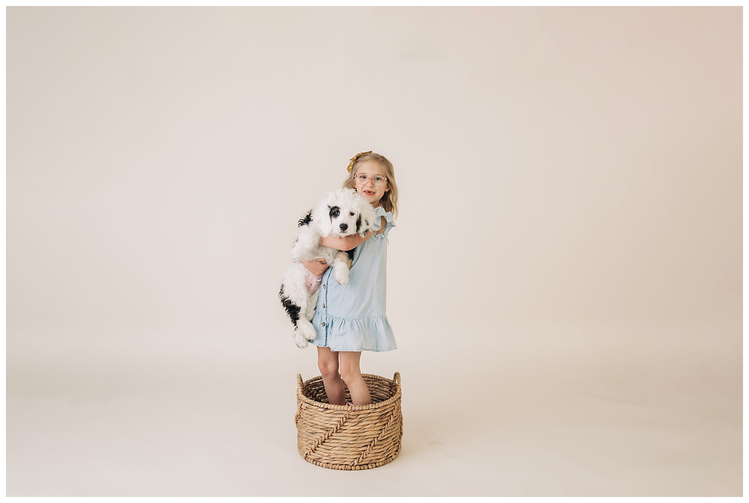 young girl holding puppy