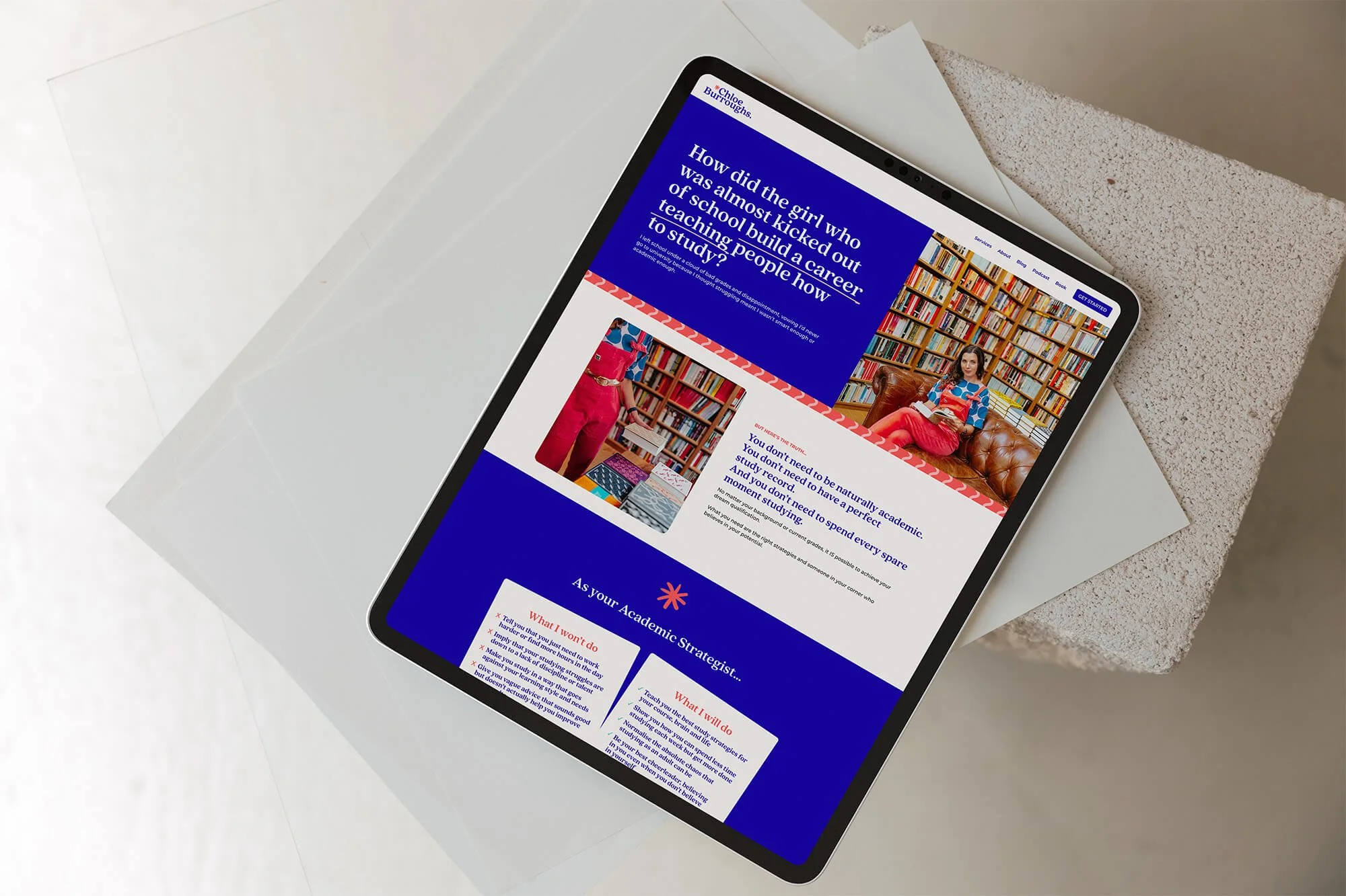 an iPad showing a vibrant, colourful website design for an academic strategist