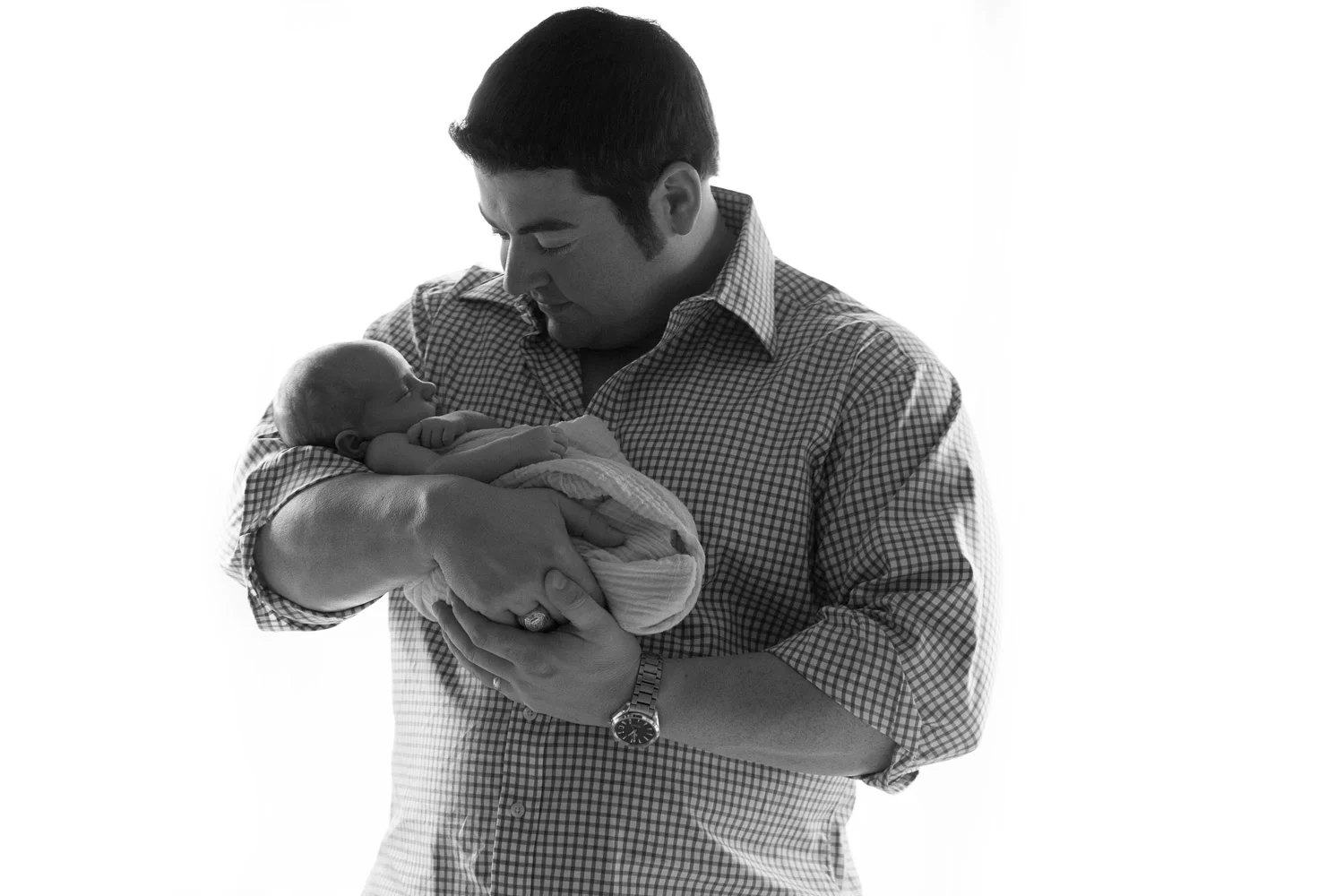 father_holding_newborn_black_and_white.jpg