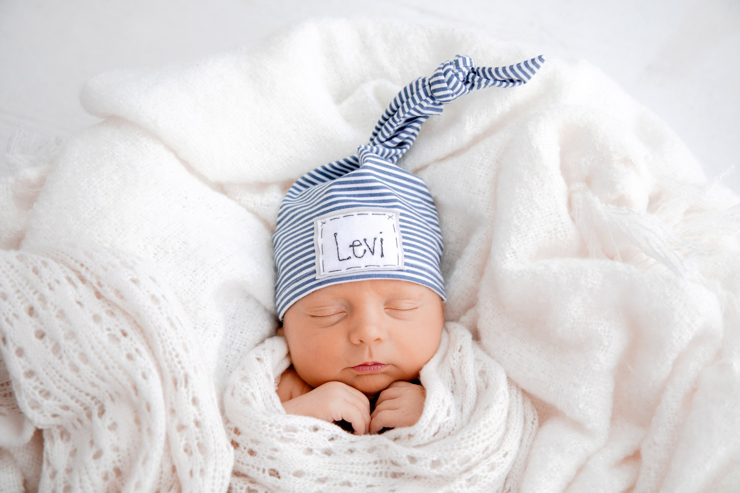 newborn photography baby with pointy hat