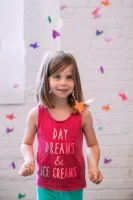 Child playing with confetti