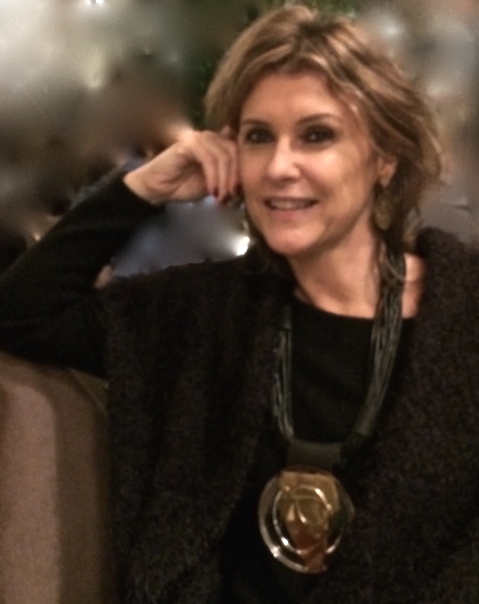 Look with round medallion necklace