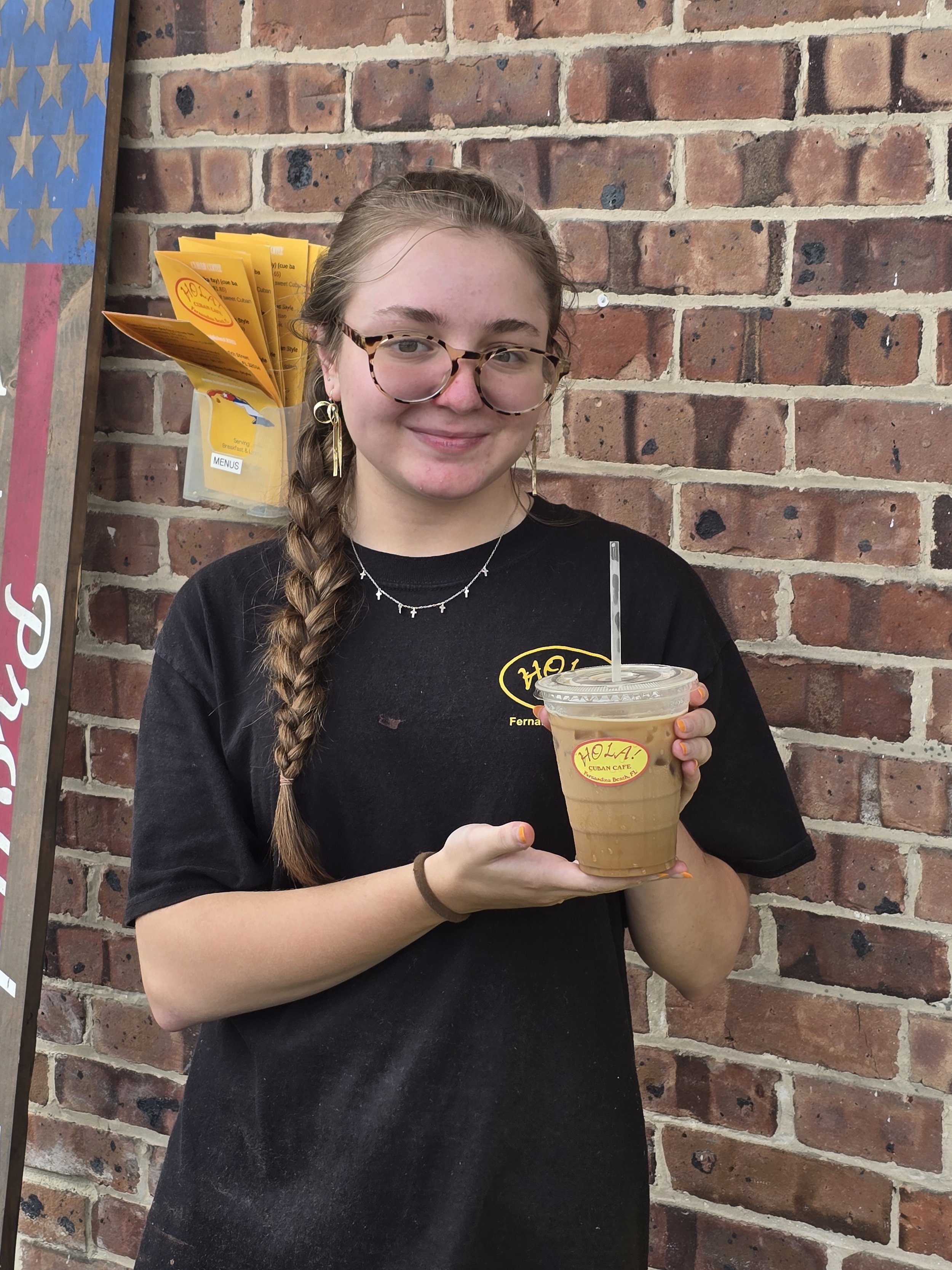 employee-holding-iced-cafe-con-leche-hola-cuban-cafe-fernandina-beach.jpg