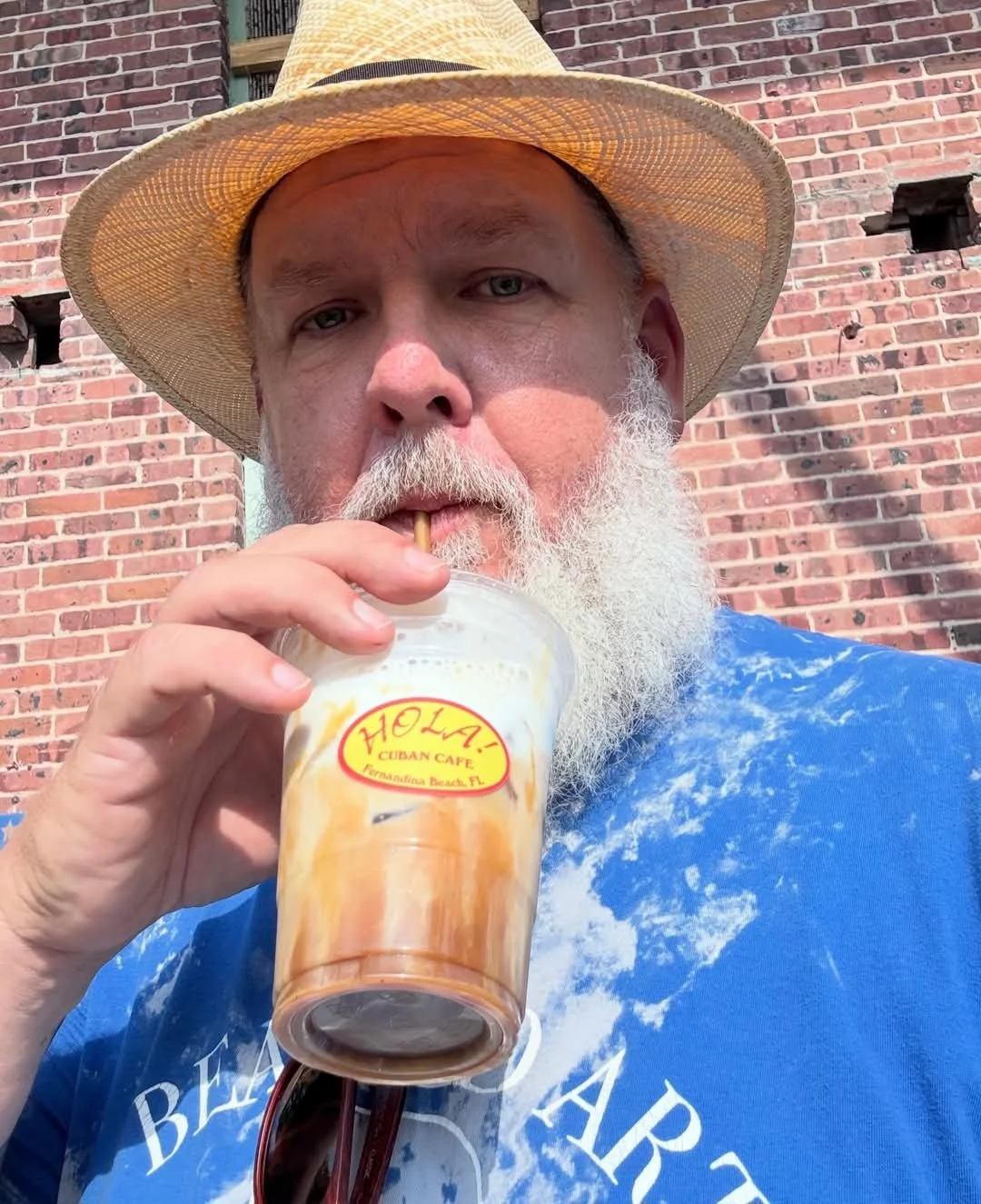 customer-drinking-iced-caramel-cafe-con-leche-hola-cuban-cafe-fernandina-beach.jpg