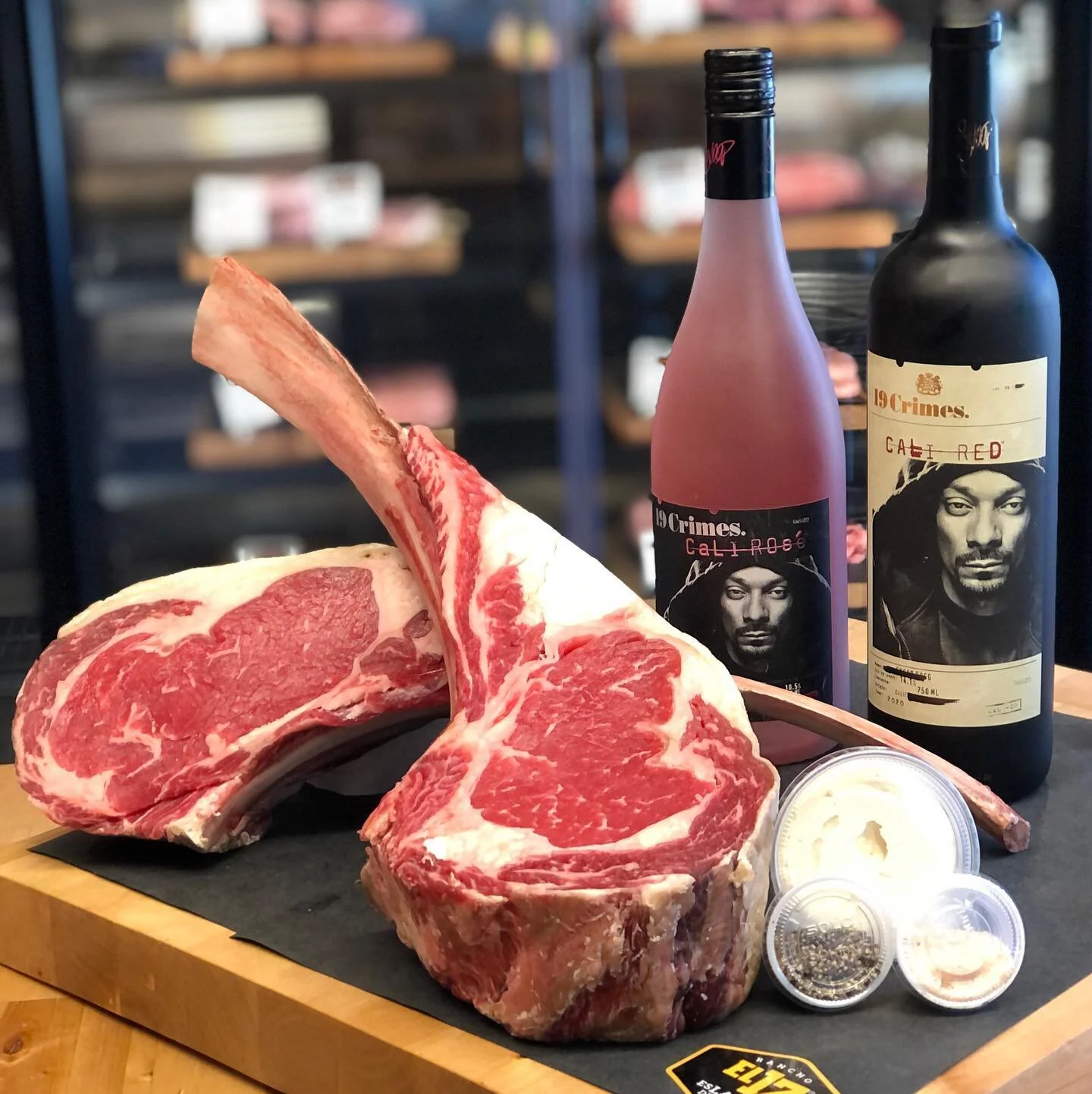 🇺🇸 Fourth of July Weekend Special! Two Rancho El 17 Tomahawks 🇲🇽 @ranchoel17 your choice of one bottle of 19 Crimes Snoop Dogg Cali Red or Cali Ros&egrave; @19crimes accompanied with our famous Butcher&rsquo;s Butter (finishing butter), one conta