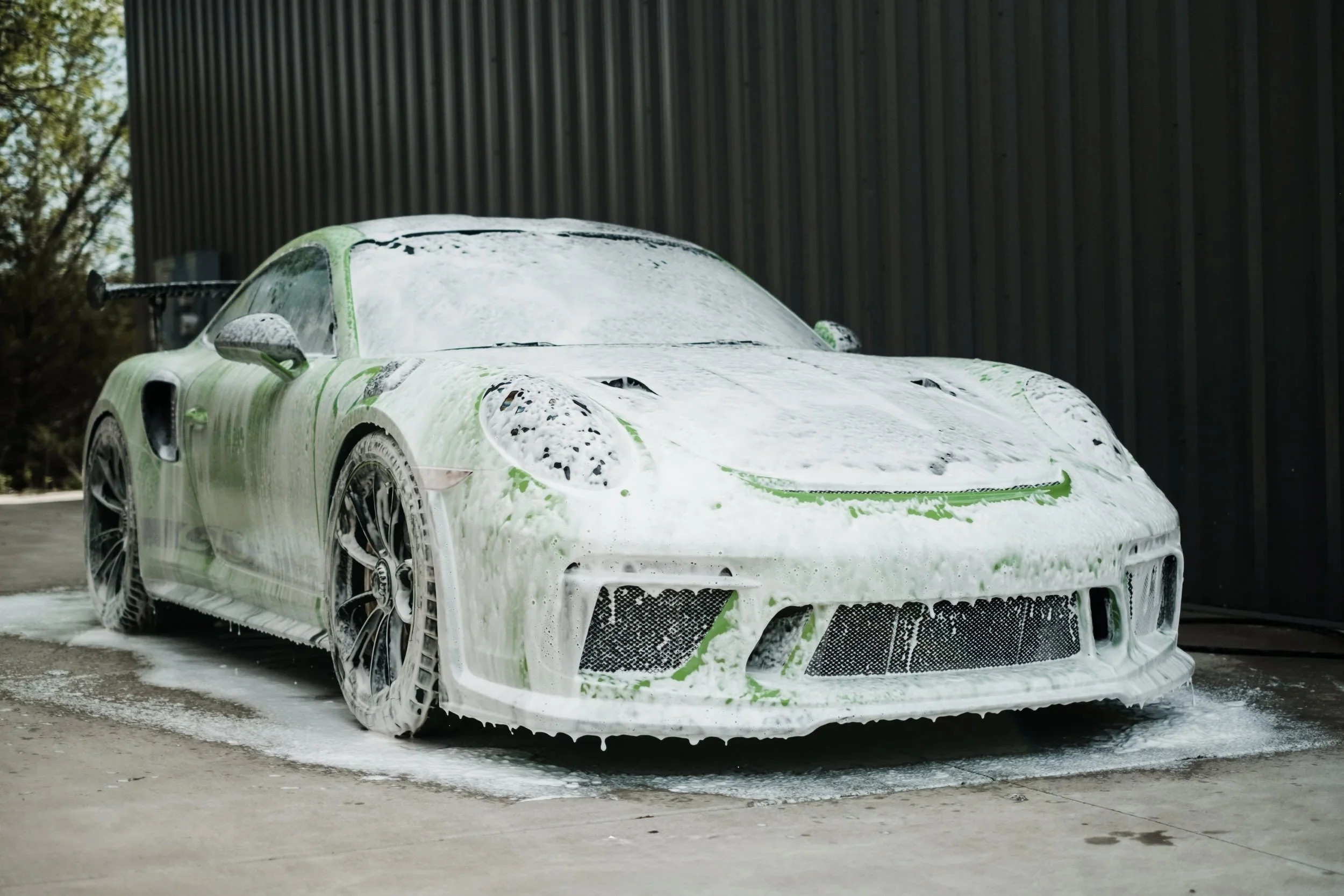 Porsche 911 with foam soap on exterior wash