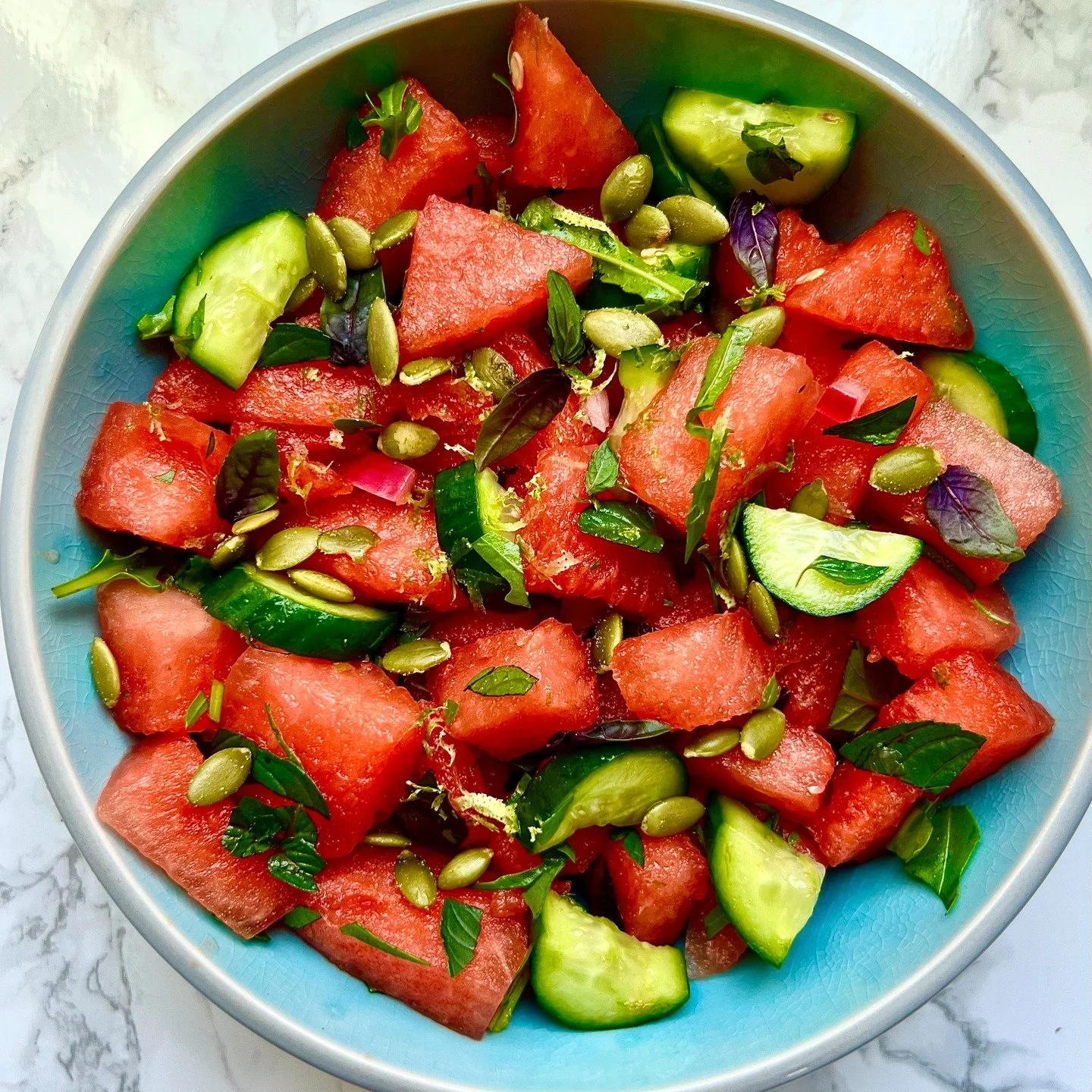 I make this watermelon salad over and over again all summer long. Cucumbers, herbs, and lime juice and zest keep the flavors light, and a handful of pepitas mixed in just before you eat adds a nice salty crunch. Toss the melon, cukes, and herbs in a 