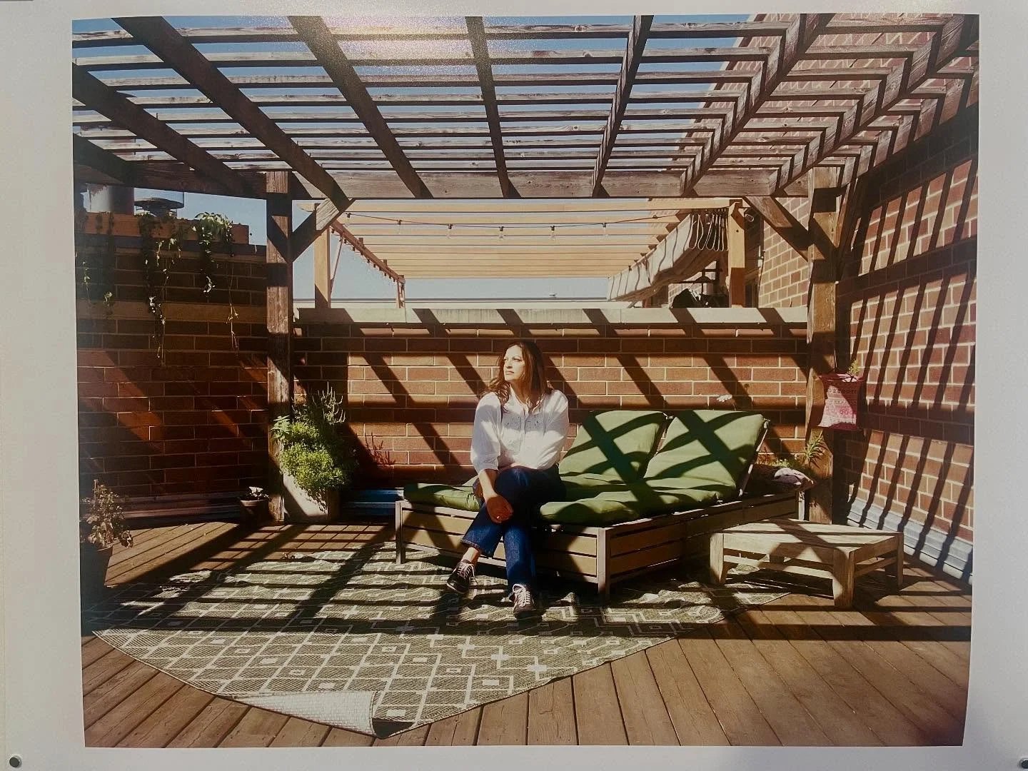 Last month, I had the honor of @leahwendzinski coming to my apartment to photograph me for her show, At Home On Earth. The sun and shadows on the back terrace hit something close to geometric perfection for the shot she chose for the show. I&rsquo;m 