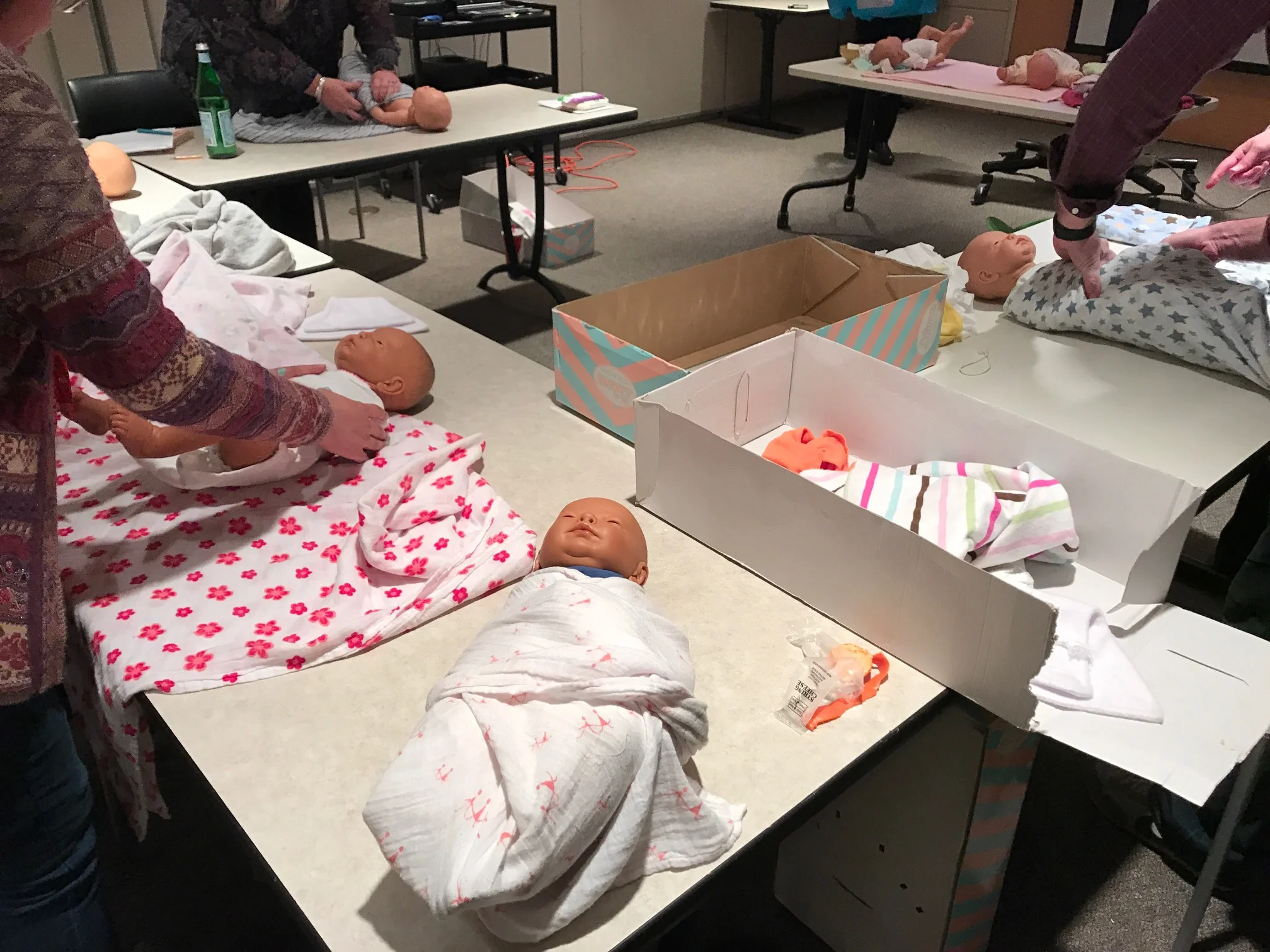 Participatory observation: immersing ourselves in the experience of expecting parents (and learning proper swaddling technique) at a childbirth education class