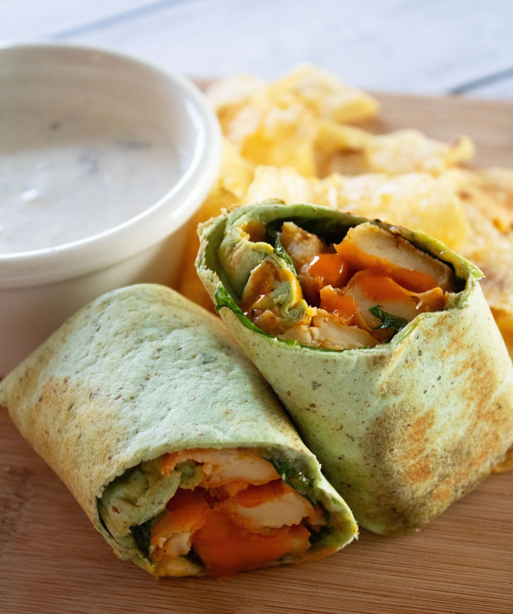 A zesty buffalo wrap is always a good idea especially with our Chickpea Tofu!
Toss crispy Franklin Farms Chickpea Tofu in your favorite buffalo sauce and add to a wrap for an easy meal idea. 🌿