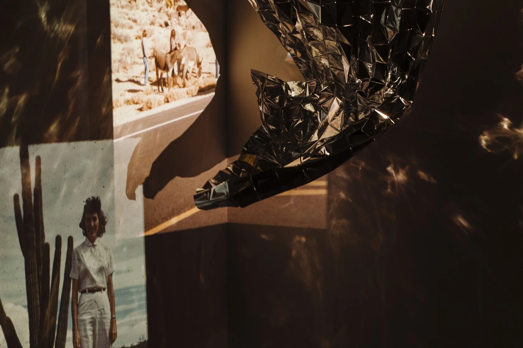 Whitmore | When the night comes | Installation with mylar, fans, found and family slide negatives, projectors