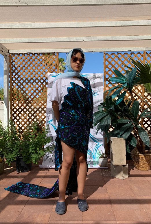 Work in Progress from 2019. Modeled by Hue. Made of casino promotion t-shirts and deconstructed sequins dresses. Image credit Hong Chen.