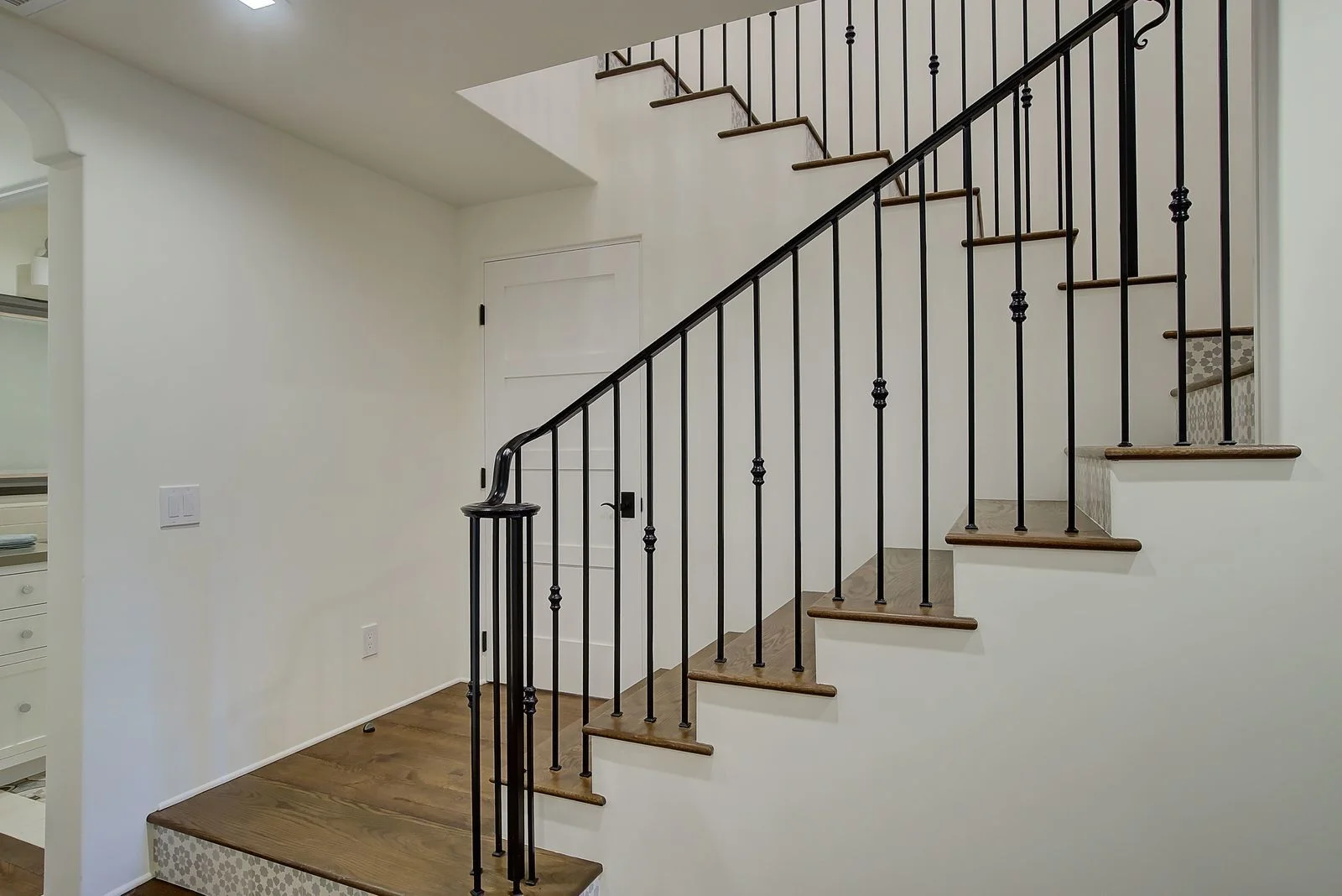 modern-spanish-staricase-wrought-iron-railing-premier-general-contractors.jpg